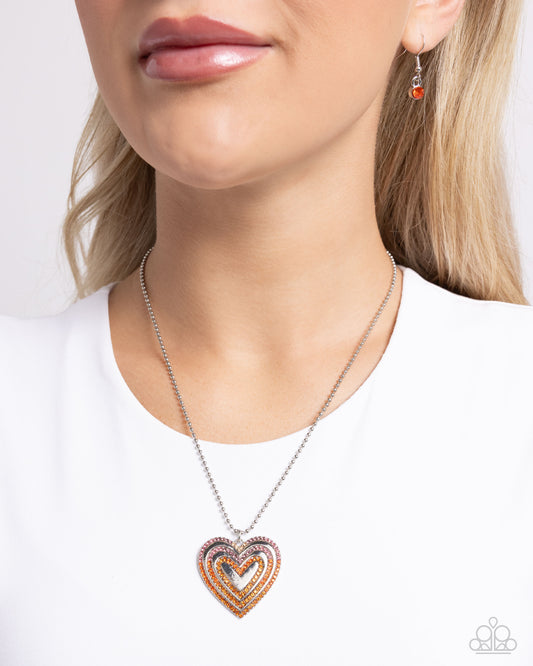 Hallucinatory Hearts Orange Necklace - Paparazzi Accessories  Featuring a variety of multicolored orange rhinestones, a layered silver heart pendant glides along a silver ball chain for a romantic statement. Each layer slowly fades to a new color, creating an ombré-like effect. Features an adjustable clasp closure.  Sold as one individual necklace. Includes one pair of matching earrings.  P2RE-OGXX-158XX
