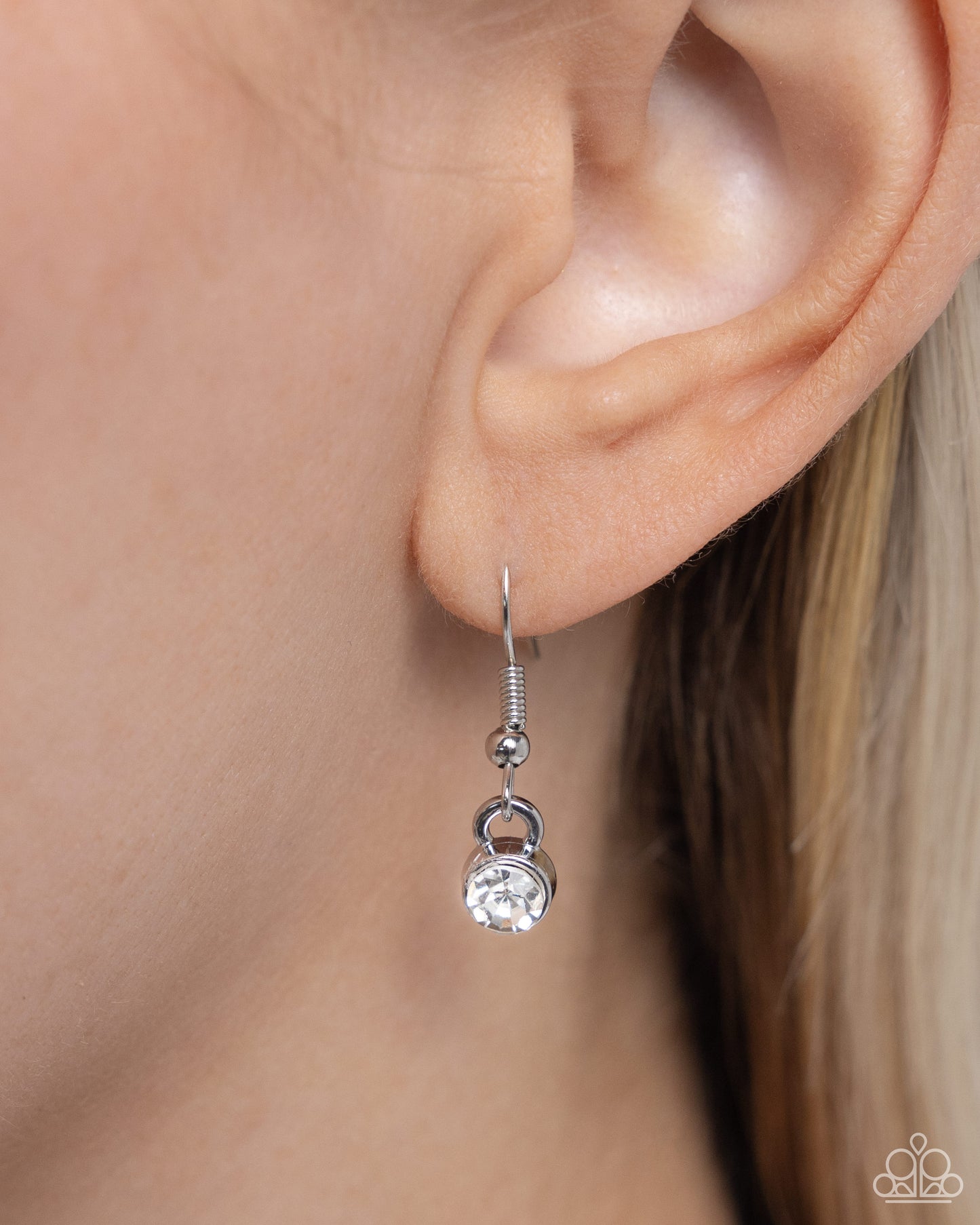 Soft-Hearted Style Black Heart Necklace - Paparazzi Accessories A gleaming black acrylic heart is nestled inside an airy, white rhinestone-encrusted heart frame, creating a charming pendant at the bottom of an exaggerated silver paperclip chain. A quintet of white gems interrupts the silver paperclip chain for additional refinement and shimmer. Features a toggle clasp closure. Sold as one individual necklace. Includes one pair of matching earrings. SKU: P2RE-BKXX-483XX