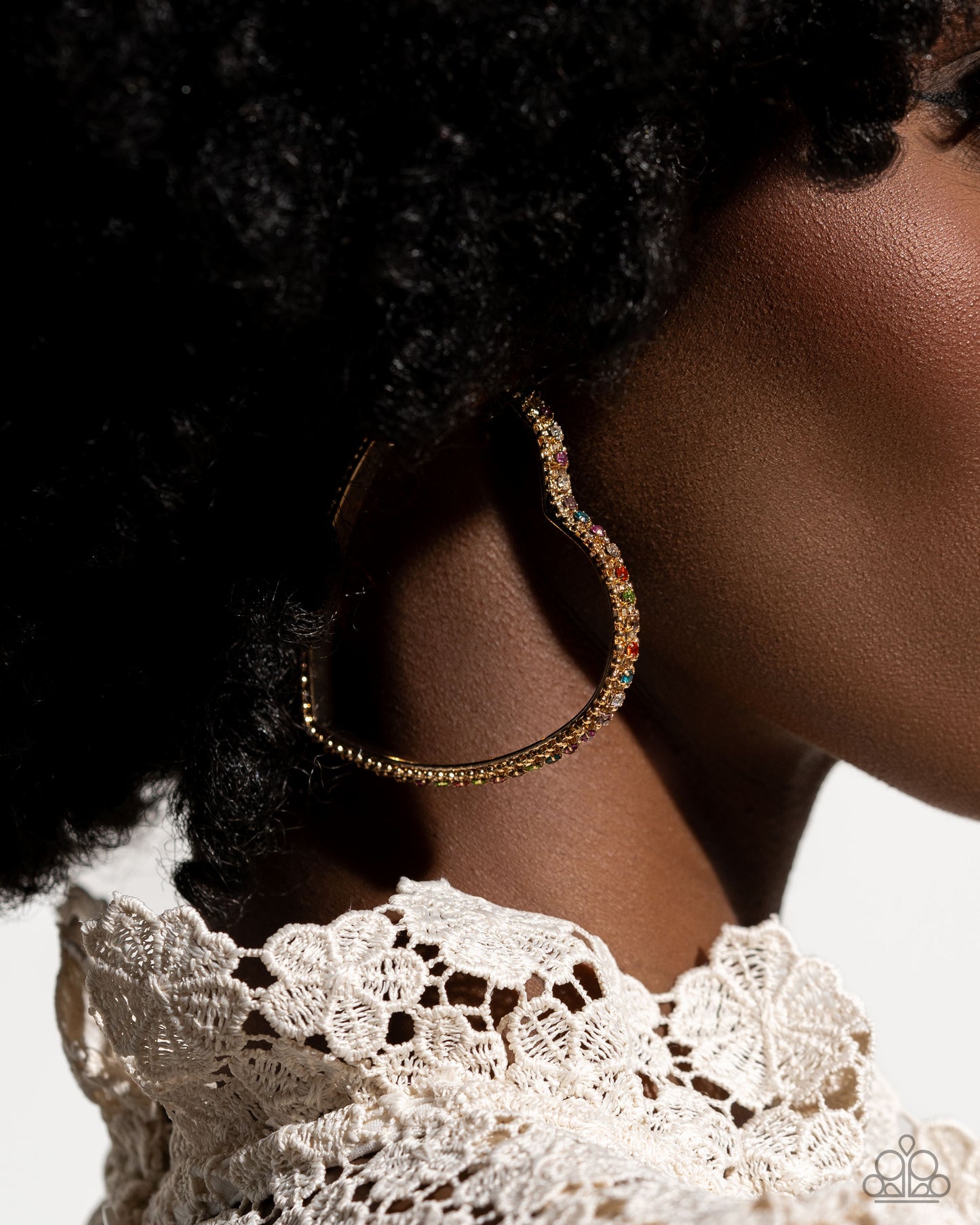 Halftime Hearts Gold Multi Hoop Earring - Paparazzi Accessories Set in gold lace-like fittings, a collection of multicolored rhinestones curl around a gold heart frame for a feminine display. Earring attaches to a standard post fitting. Hoop measures approximately 2 1/2" in diameter. Sold as one pair of hoop earrings. P5HO-MTGD-110XX