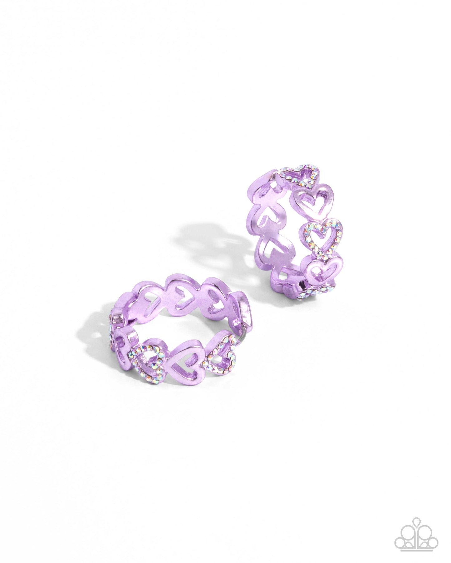 Historic Hearts Purple Hinge Hoop Earring - Paparazzi Accessories Featuring a metallic purple dip, glittery iridescent rhinestone-embellished hearts alternate with sleek hearts as they curve along the ear for a romantic statement. Earring attaches to a standard hinge closure fitting. Hoop measures approximately 1" in diameter. Due to its prismatic palette, color may vary. Sold as one pair of hinge hoop earrings. P5HO-PRXX-033XX