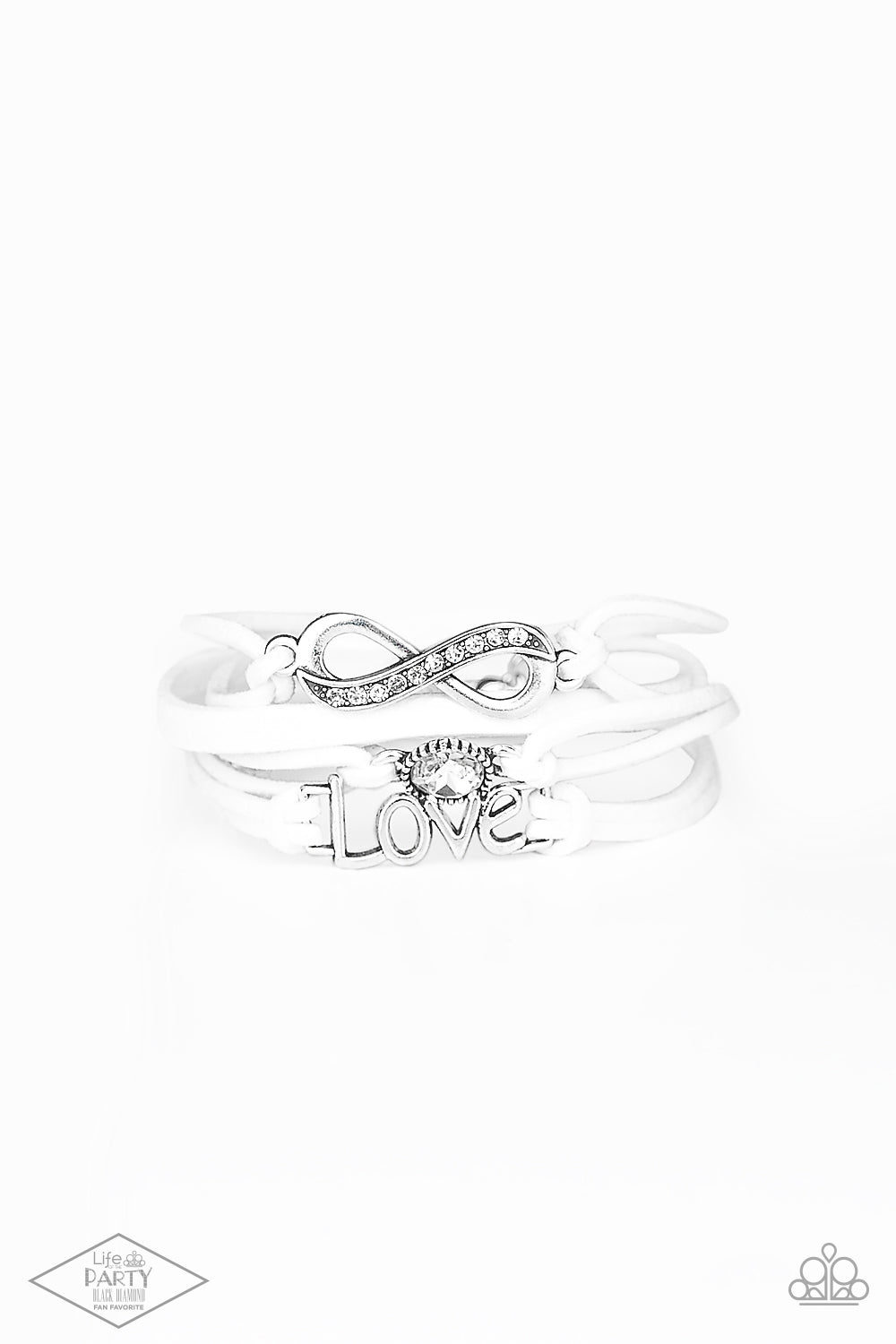 Infinitely Irresistible White Bracelet - Paparazzi Accessories Strands of white suede knot around silver charms, including a glittery infinity charm, a solitaire rhinestone, and a charm whimsically spelling out “love” across the wrist. Features an adjustable clasp closure. Sold as one individual bracelet. This Fan Favorite is back in the spotlight at the request of our 2021 Life of the Party member with Black Diamond Access, Miranda B.
