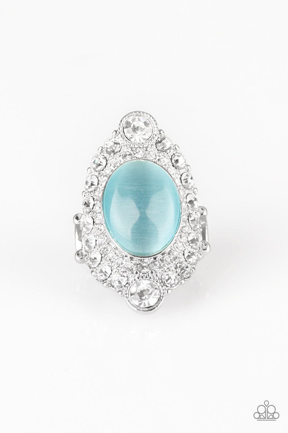 Riviera Royalty - Blue A glowing blue moonstone is pressed into a dramatic silver band radiating with glassy white rhinestones for a glamorous flair. Features a stretchy band for a flexible fit. Sold as one individual ring.