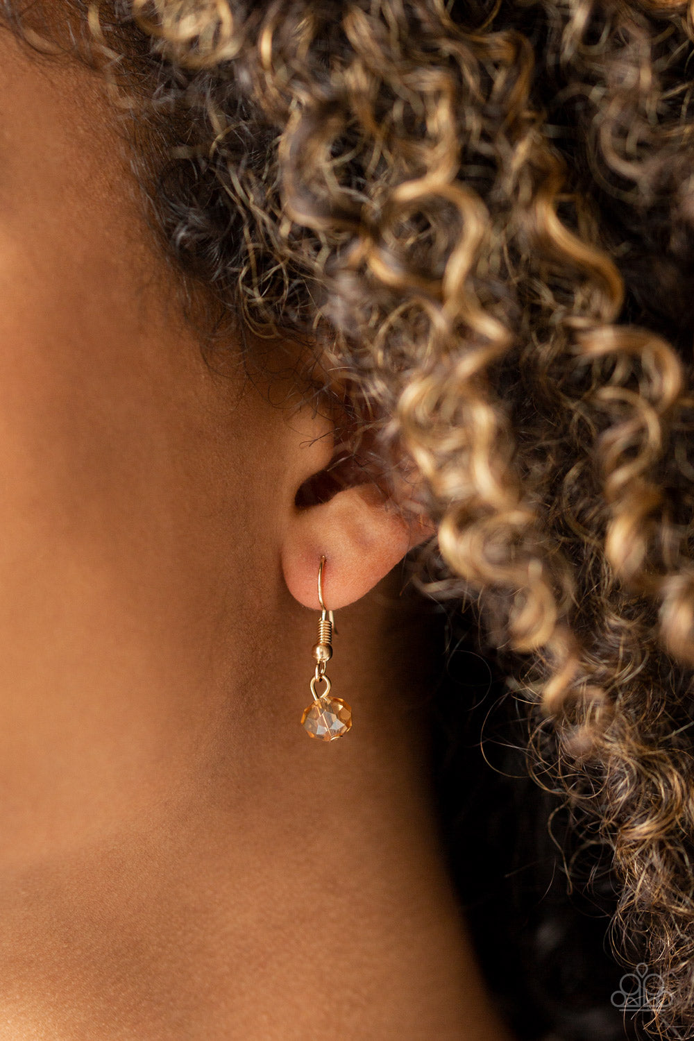 Dare To Dazzle - Gold Item #N635 Infused with golden crystal-like beads, a pair of golden gems gives way to layers of mismatched gold chains for a dazzling look. Features an adjustable clasp closure. All Paparazzi Accessories are lead free and nickel free! Sold as one individual necklace. Includes one pair of matching earrings.