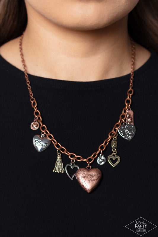 Heart Of Wisdom Multi Necklace - Paparazzi Accessories  An array of brass, copper, and silver heart charms trickle from a section of bold copper chain, creating a whimsical fringe below the collar. The largest heart charm is inscribed with the phrase, “With all my heart” on one side and a short bible verse on the other that reads, "Love the lord thy God with all your heart. Luke 10:27.” Sold as one individual necklace. Includes one pair of matching earrings.  P2WH-MTXX-144XX
