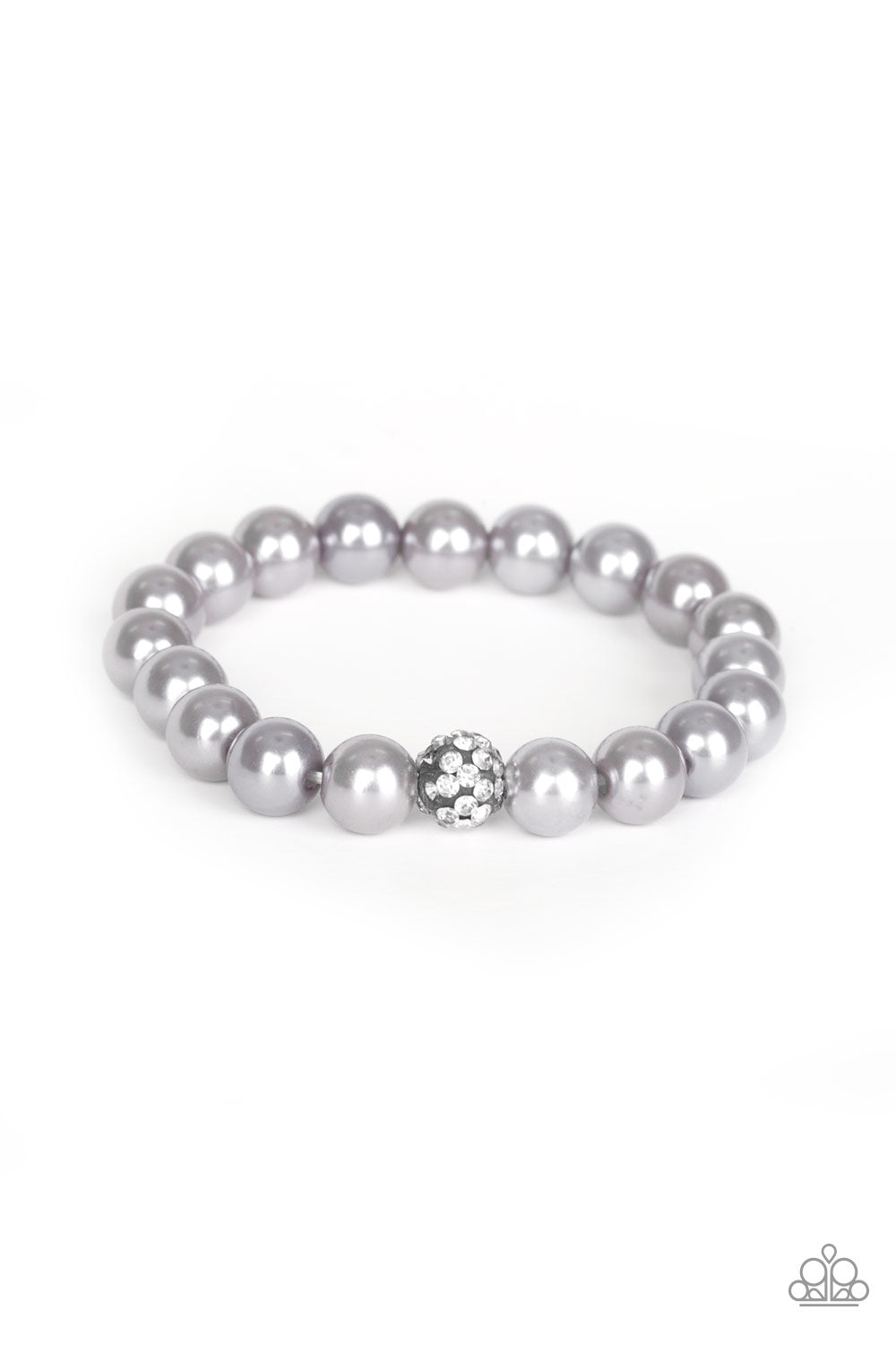 POSHing Your Luck Silver Bracelet - Paparazzi Accessories. Infused with a glittery rhinestone encrusted bead, a collection of silver pearls are threaded along a stretchy band around the wrist for a glamorous look. All Paparazzi Accessories are lead free and nickel free! Sold as one individual bracelet. Get The Complete Look! Necklace: "Posh Boss - Silver" (Sold Separately)