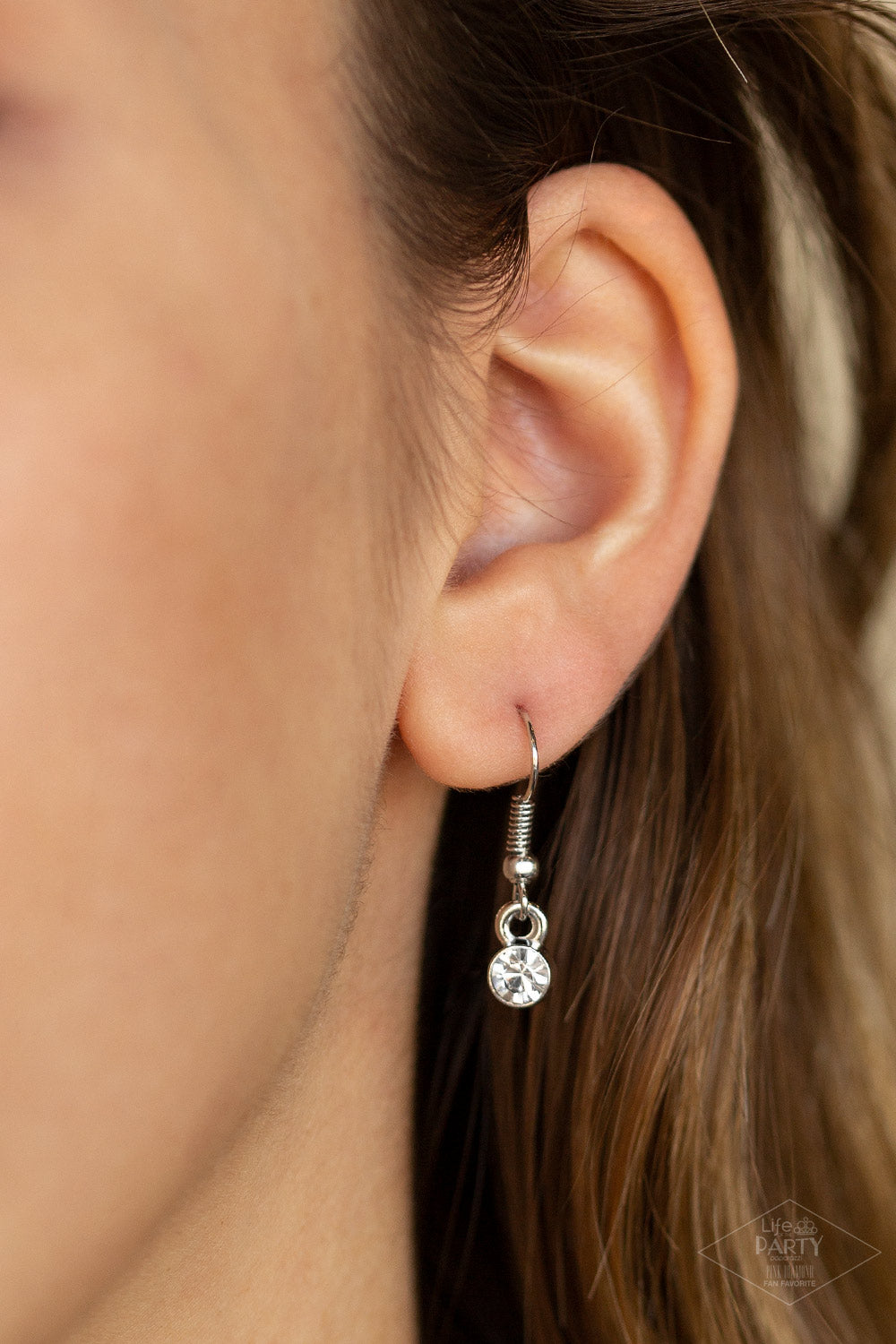 Unlock Every Door Red Necklace. A luminescent red cat's eye stone is pressed into a silver key charm, creating a colorful pendant. Infused with iridescent red cat's eye beading, the silver key is encrusted in glittery white rhinestones for a dazzling finish. Features an adjustable clasp closure. All Paparazzi Accessories are lead free and nickel free! Includes one pair of matching earrings. This Fan Favorite is back in the spotlight in an all new color.