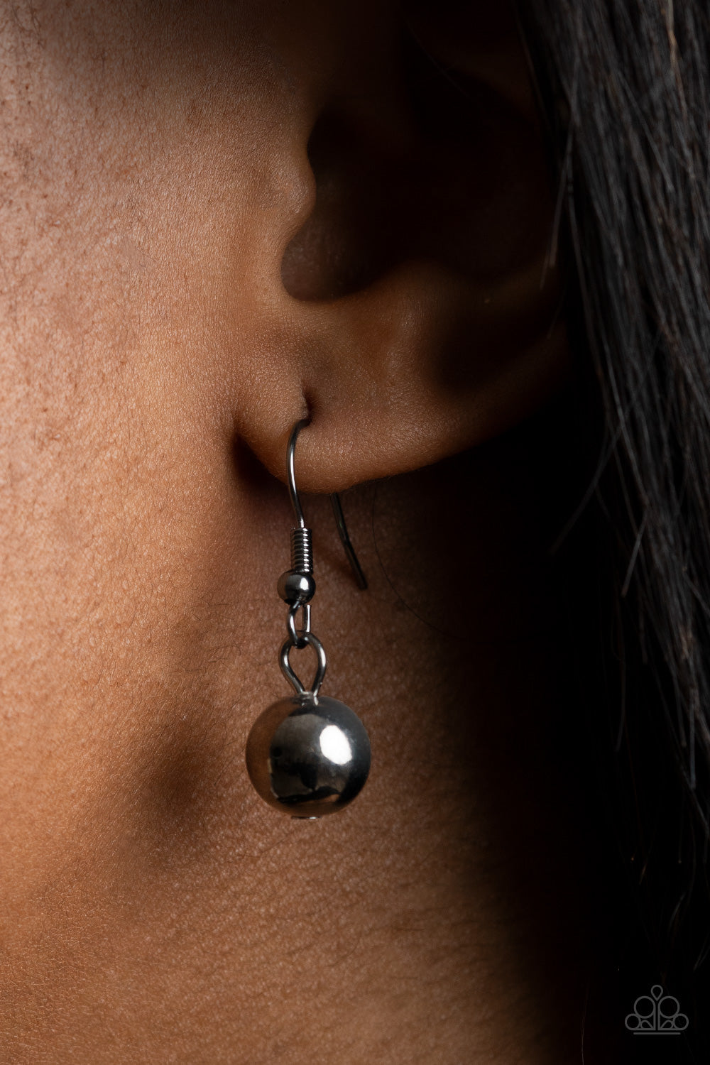 Gallery Goddess Black Necklace - Paparazzi Accessories. Hammered teardrop-like frames and oversized gunmetal beads alternate along a round gunmetal herringbone chain, creating an intense industrial inspired fringe below the collar. Features an adjustable clasp closure. All Paparazzi Accessories are lead free and nickel free! Sold as one individual necklace. Includes one pair of matching earrings.