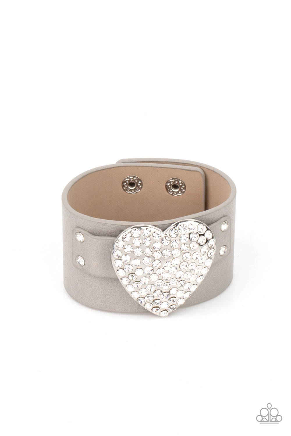 Flauntable Flirt Silver Wrap Bracelet - Paparazzi Accessories Encrusted in blinding white rhinestones, an oversized silver heart frame is studded in place across the front of a gray leather band, creating a flirtatious centerpiece around the wrist. Features an adjustable snap closure. All Paparazzi Accessories are lead free and nickel free! Sold as one individual bracelet.