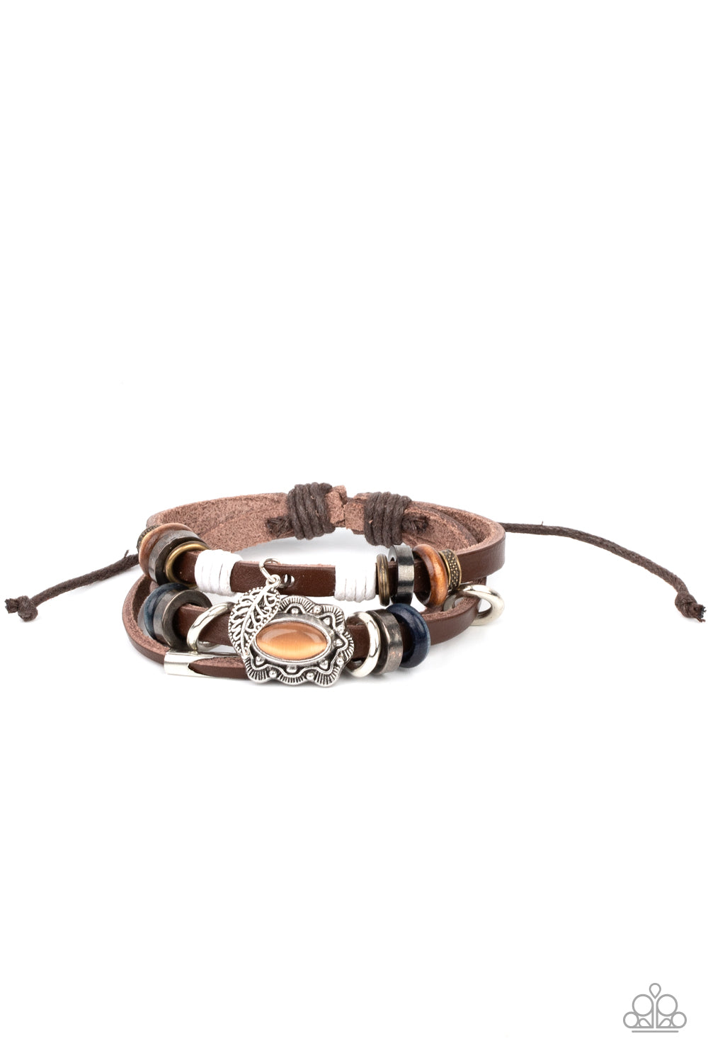 Mystically Mediterranean Orange Urban Bracelet - Paparazzi Accessories. Infused with a scalloped orange cat's eye stone centerpiece, three layered leather bands are embellished with a mismatched collection of wooden and metallic rings for a seasonal finish. Features an adjustable sliding knot closure. All Paparazzi Accessories are lead free and nickel free! Sold as one individual bracelet.