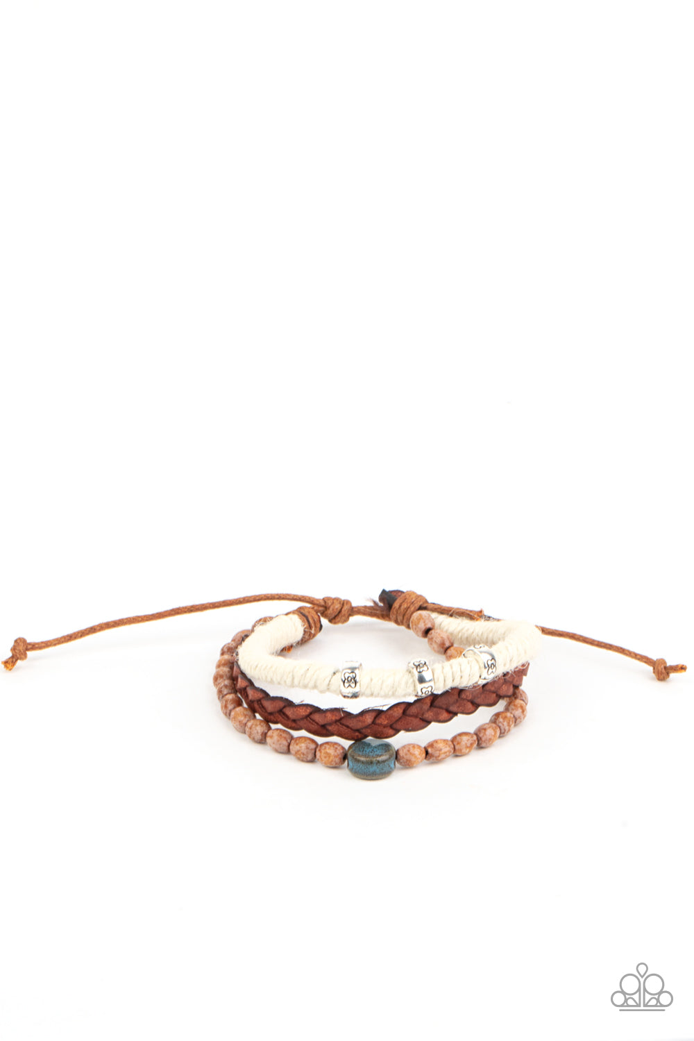 Terrarium Terrain Blue Urban Bracelet - Paparazzi Accessories Featuring floral stamped accents and a colorful ceramic-like bead, strands of wooden beads, white twine, and braided leather layer around the wrist for an earthy look. Features an adjustable sliding knot closure. All Paparazzi Accessories are lead free and nickel free! Sold as one individual bracelet.