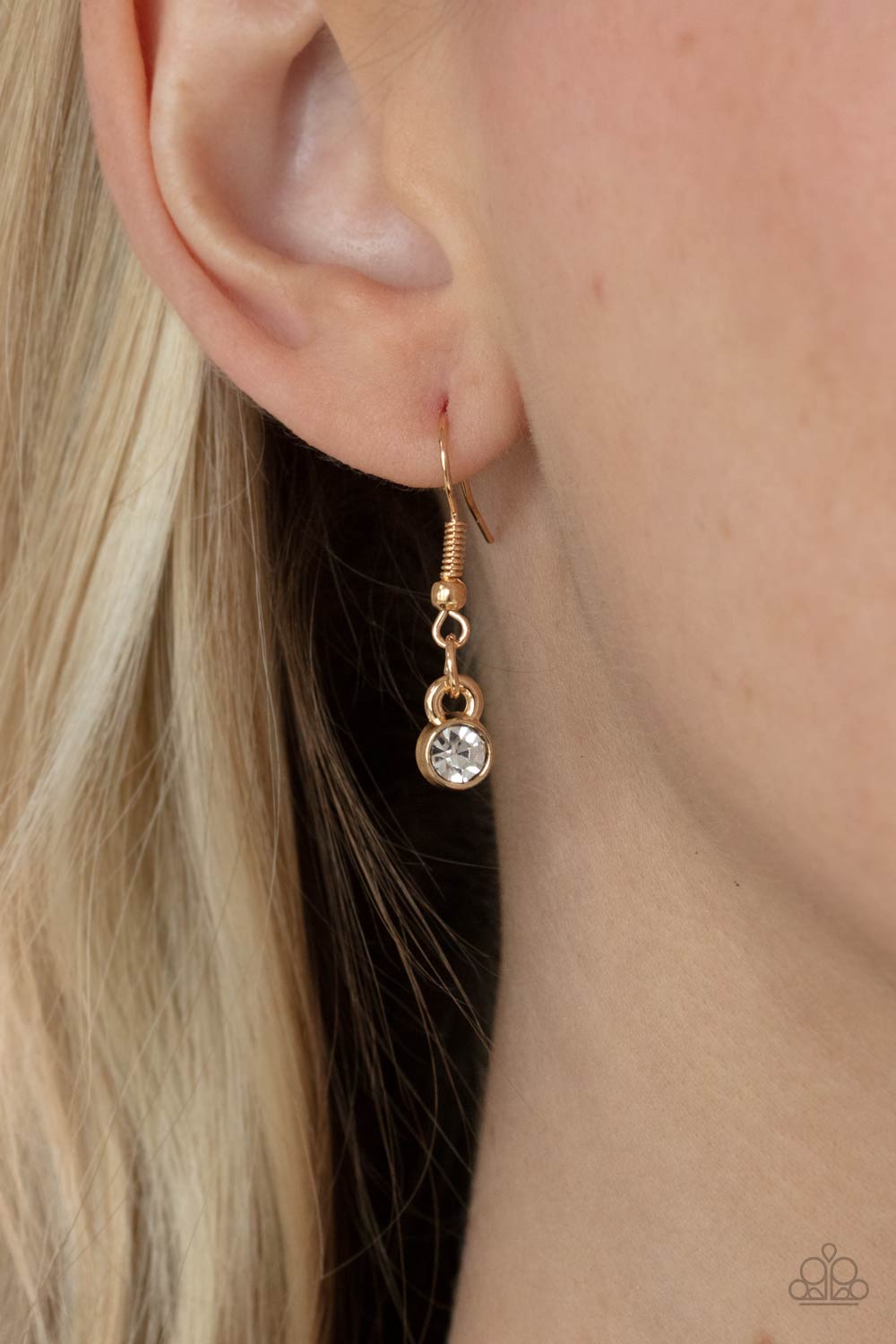 Deluxe Diadem Gold Necklace - Paparazzi Accessories Dotted in a dainty collection of classic round and regal marquise cut rhinestones, airy gold petals fan out below the collar, creating a stunning pendant. Features an adjustable clasp closure. All Paparazzi Accessories are lead free and nickel free! Sold as one individual necklace. Includes one pair of matching earrings.