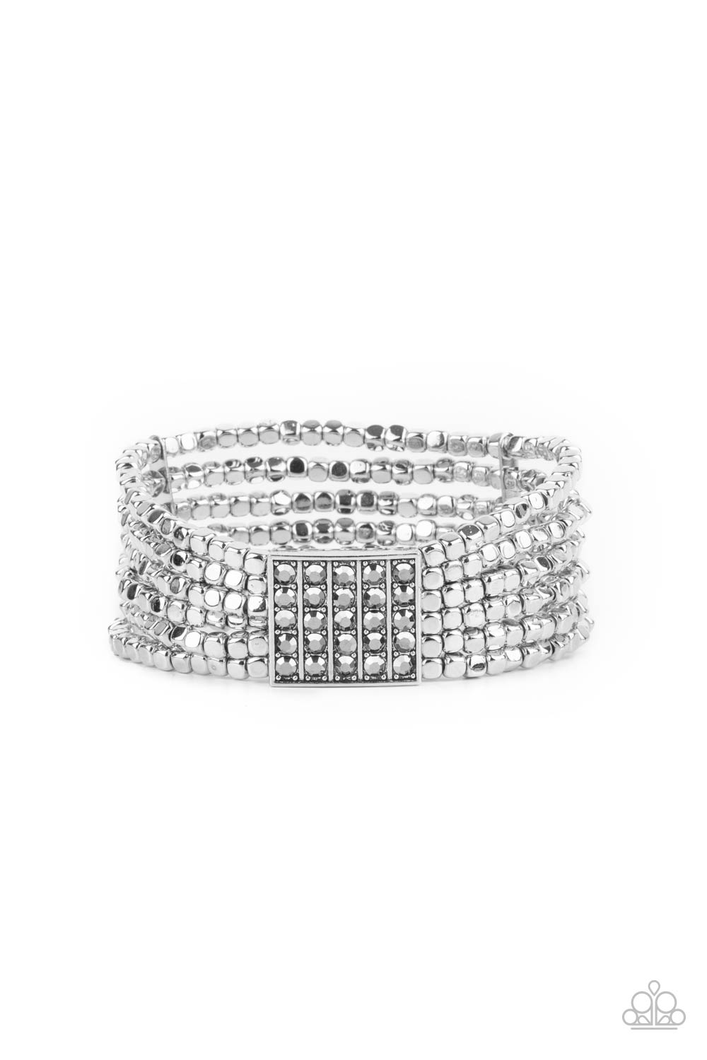 Star-Studded Showcase Silver Bracelet - Paparazzi Accessories Held in place by a square centerpiece encrusted in row after row of dazzling hematite rhinestones, a dainty collection of silver cube beads are threaded along stretchy bands around the wrist, creating shimmery layers. All Paparazzi Accessories are lead free and nickel free! Sold as one individual bracelet.