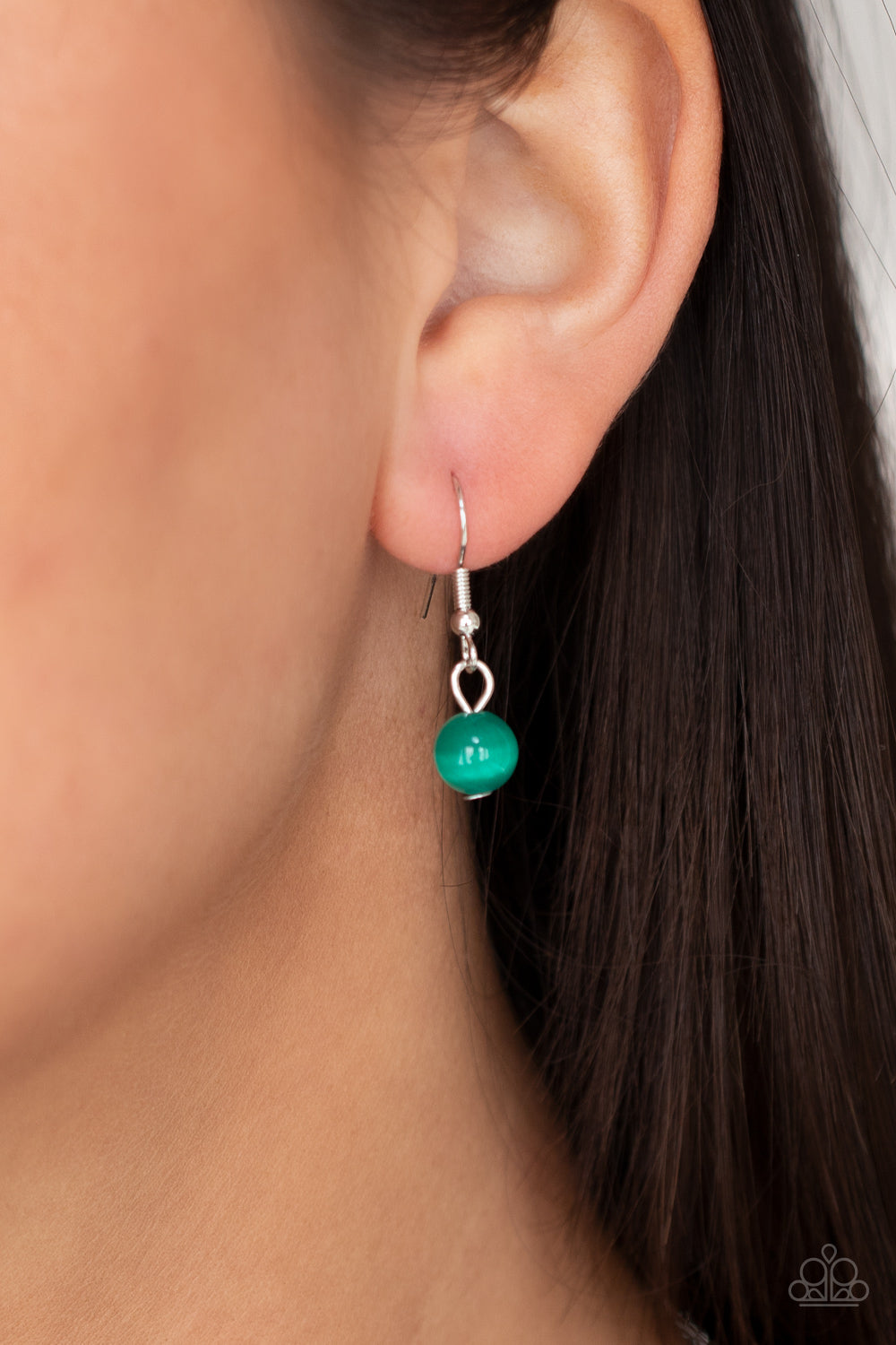 Warmhearted Glow Green Heart Necklace - Paparazzi Accessories An oversized Mint cat's eye stone frame swings from the bottom of a lengthened silver chain, creating a flirtatious pendant. Features an adjustable clasp closure. All Paparazzi Accessories are lead free and nickel free! Sold as one individual necklace. Includes one pair of matching earrings.