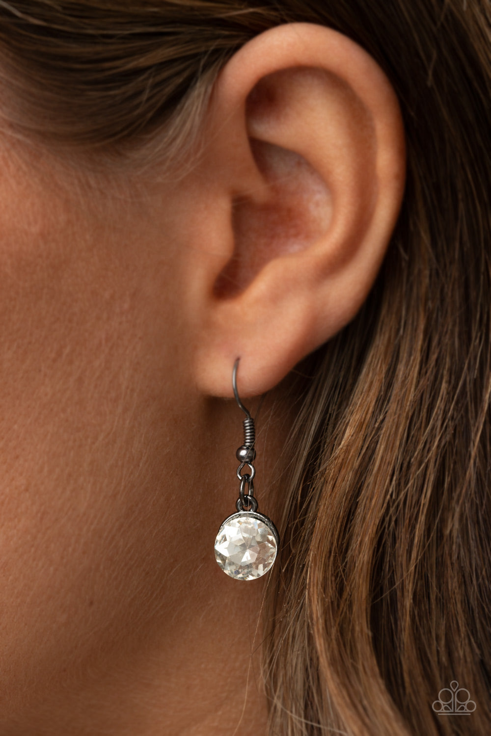 Galactic Goddess Black Necklace - Paparazzi Accessories An unexpected explosion of oversized round, teardrop, and emerald cut rhinestones cluster into haphazard groupings. The blinding clusters link together, creating a stellar statement piece that sits below the collar. Features an adjustable clasp closure. All Paparazzi Accessories are lead free and nickel free! Sold as one individual necklace. Includes one pair of matching earrings.