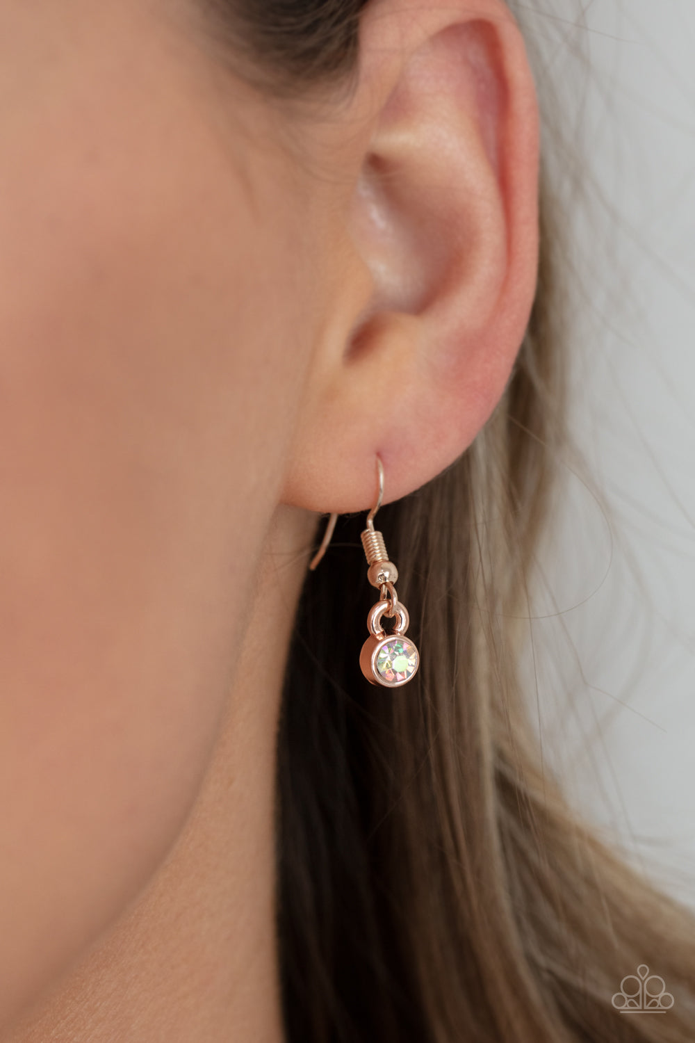 Cosmic Countess Rose Gold Necklace - Paparazzi Accessories Double stacks of iridescent oval cut gems link elegantly across the collar on a rose gold chain for a deliriously cosmic flair of glamour. Features an adjustable clasp closure. All Paparazzi Accessories are lead free and nickel free! Sold as one individual necklace. Includes one pair of matching earrings.