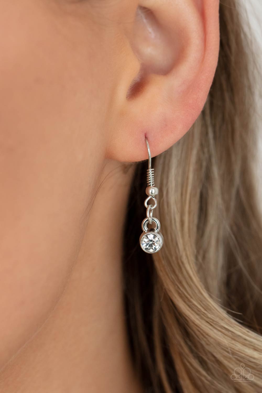 Unfiltered Confidence White Necklace - Paparazzi Accessories A trio of brilliant white square gut gems encased in classic silver fittings takes center stage. Teardrop and round gems link to a silver chain on either side of the trio for a striking display below the collar. Features an adjustable clasp closure. All Paparazzi Accessories are lead free and nickel free! Sold as one individual necklace. Includes one pair of matching earrings.