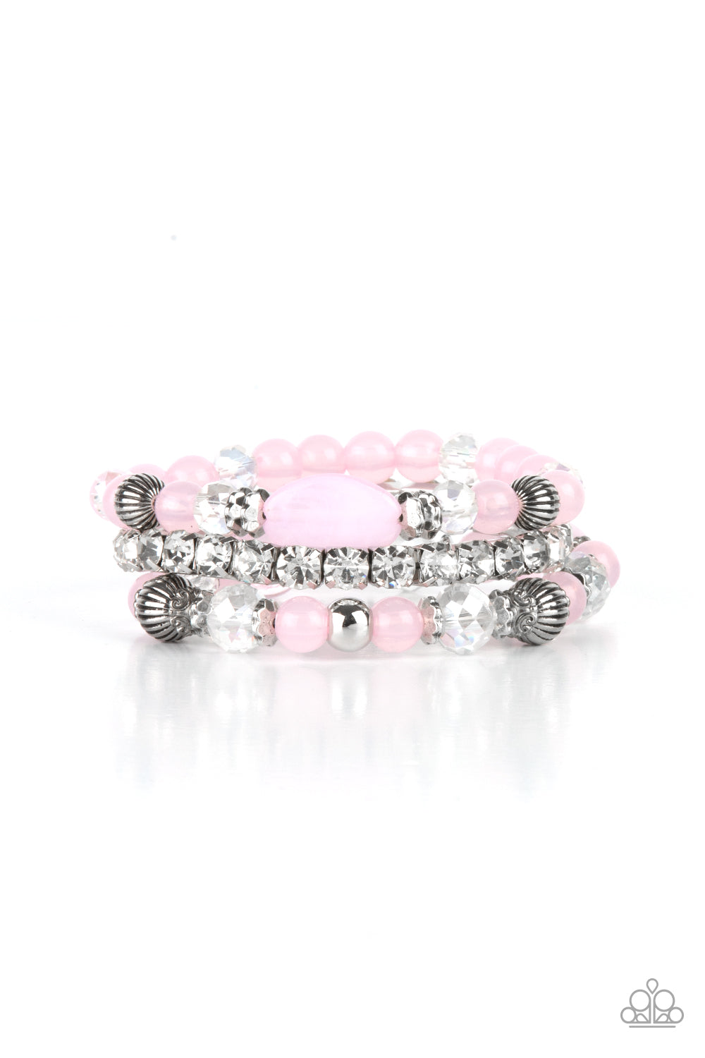 Ethereal Etiquette Pink Bracelet - Paparazzi Accessories Infused with a stretchy strand of glassy white rhinestones, a mismatched collection of cloudy pink, white crystal-like, and ornate silver accents are threaded along stretchy bands around the wrist, creating ethereal layers. All Paparazzi Accessories are lead free and nickel free! Sold as one set of three bracelets.
