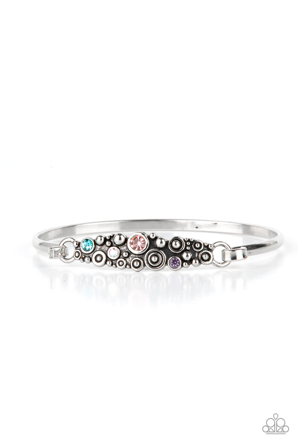 Bubbling Whimsy Multi Cuff Bracelet - Paparazzi Accessories A cluster of engraved and antiqued silver swirls merge with colorful rhinestones and coalesce into a whimsical display across the wrist on a dainty silver cuff. Features a hook and eye closure. Sold as one individual bracelet.