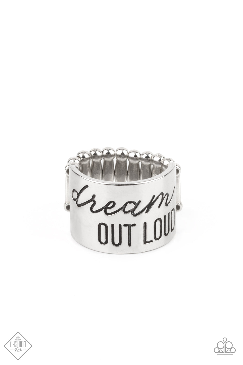 Dream Louder Silver Ring - Paparazzi Accessories The front of a thick silver band is stamped in the phrase, "Dream out loud," creating an inspirational centerpiece across the finger. Features a stretchy band for a flexible fit. All Paparazzi Accessories are lead free and nickel free! Sold as one individual ring.