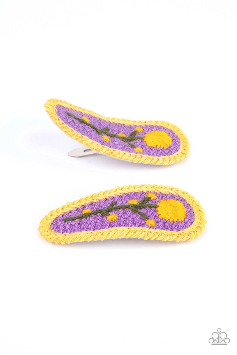 Bloom Loom Purple Hair Clip - Paparazzi Accessories A vibrant purple backdrop showcases a softly embroidered whimsical blossom. Each flower features a standard hair clip on the back. All Paparazzi Accessories are lead free and nickel free! Sold as one pair of hair clips.