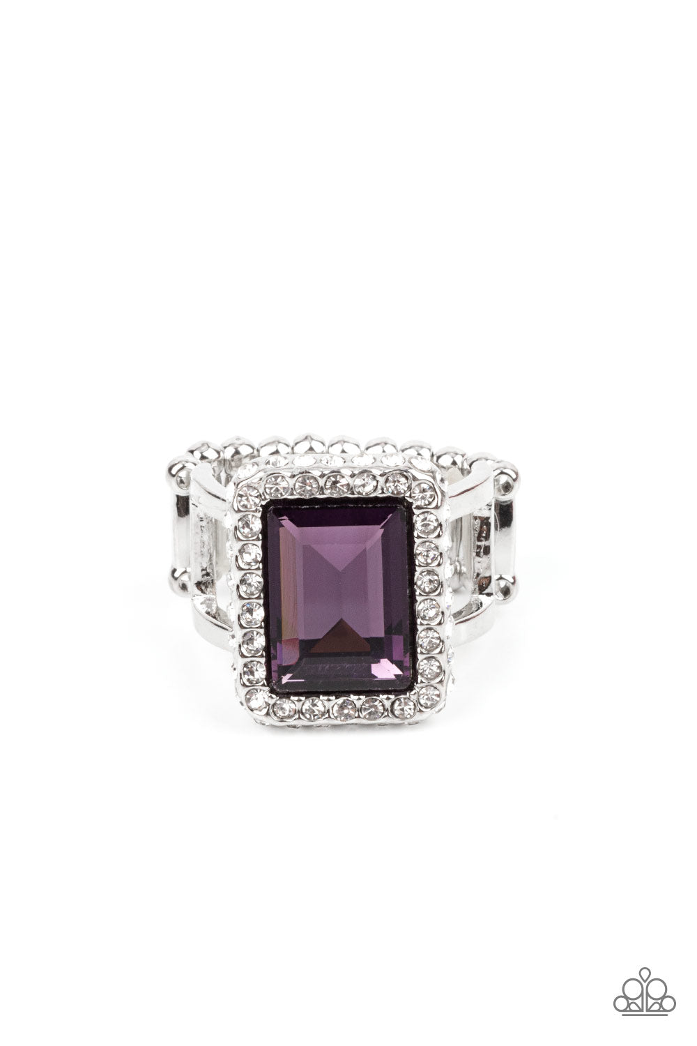Glamorously Glitzy Purple Ring - Paparazzi Accessories Bordered in a sparkly frame of white rhinestones, an oversized purple emerald cut gem adorns layered silver bands atop the finger for a jaw-dropping fashion. Features a stretchy band for a flexible fit. All Paparazzi Accessories are lead free and nickel free! Sold as one individual ring.