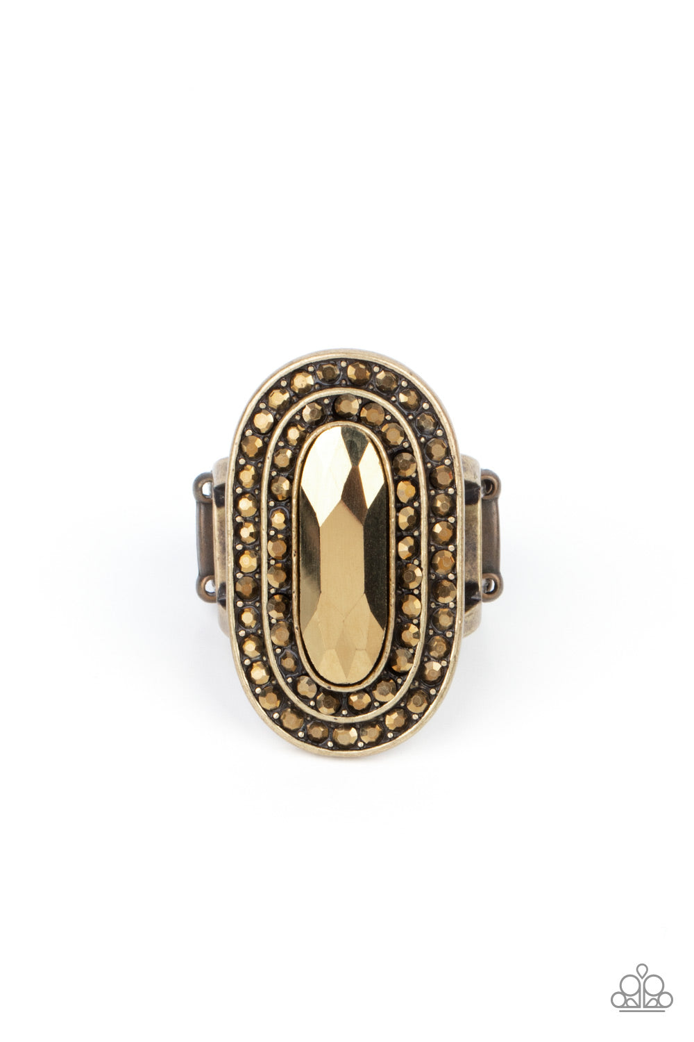 Fueled by Fashion Brass Ring - Paparazzi Accessories An elongated sparkling aurum gem is nestled inside a linear brass frame created by double rows of dainty aurum rhinestones. The faceted gem creates a glamorously edgy effect atop the finger. Features a stretchy band for a flexible fit. Sold as one individual ring.