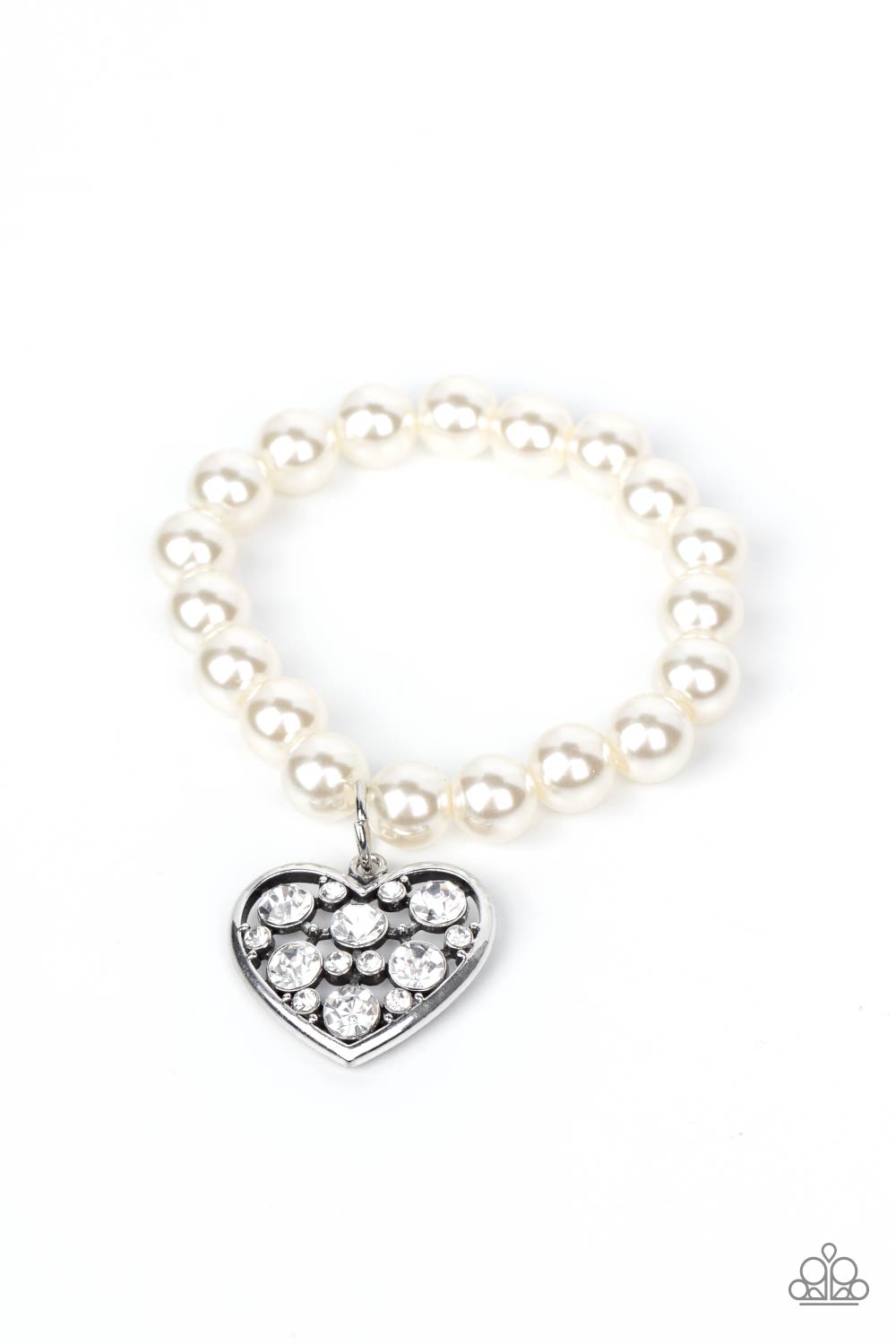 Cutely Crushing White Pearl Bracelet - Paparazzi Accessories A dramatically oversized white rhinestone encrusted silver heart charm dangles from a stretchy strand of bubbly white pearls, creating a flirtatious dazzle. All Paparazzi Accessories are lead free and nickel free! Sold as one individual bracelet.