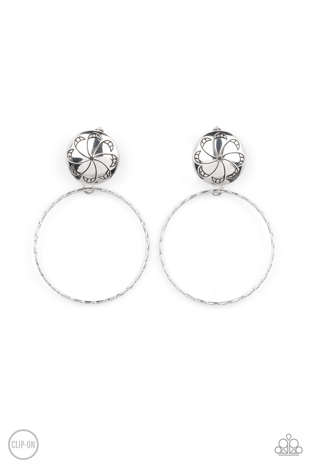 Rural Renewal Silver Clip-On Earring - Paparazzi Accessories A textured silver hoop swings from the bottom of a silver fitting stamped in a frilly floral pattern, creating a whimsical display. Earring attaches to a standard clip-on fitting. Sold as one pair of clip-on earrings.
