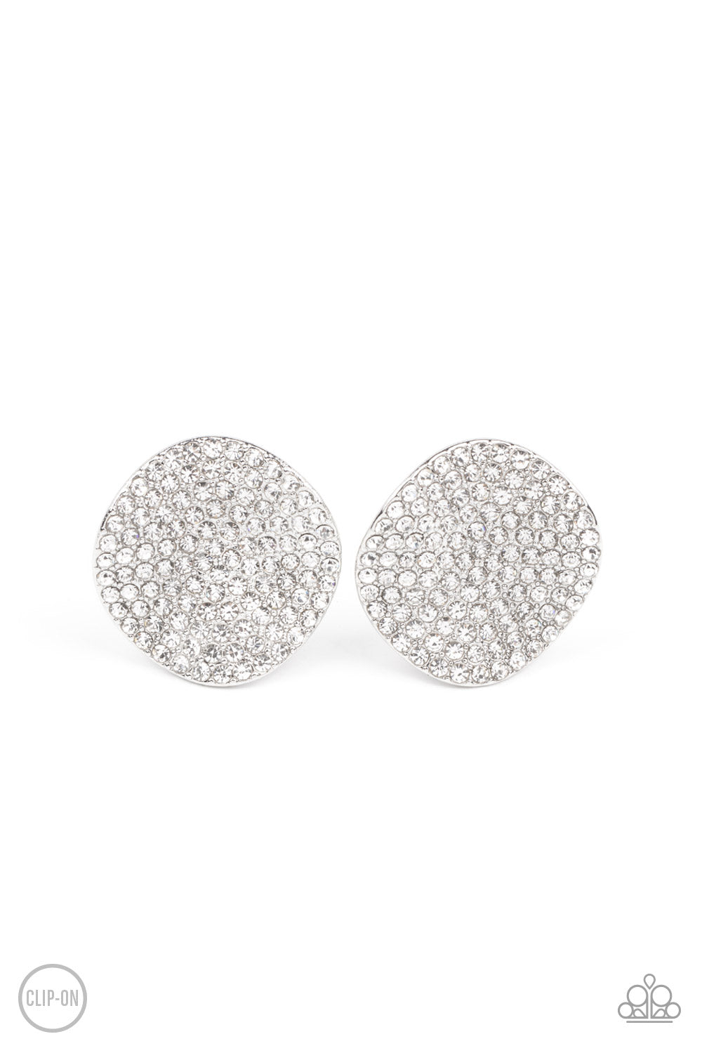Lunch at the Louvre White Clip-On Earring - Paparazzi Accessories The front of a warped silver disc is encrusted in row after row of blinding white rhinestones, resulting in a refined display. Earring attaches to a standard clip-on fitting. Sold as one pair of clip-on earrings.