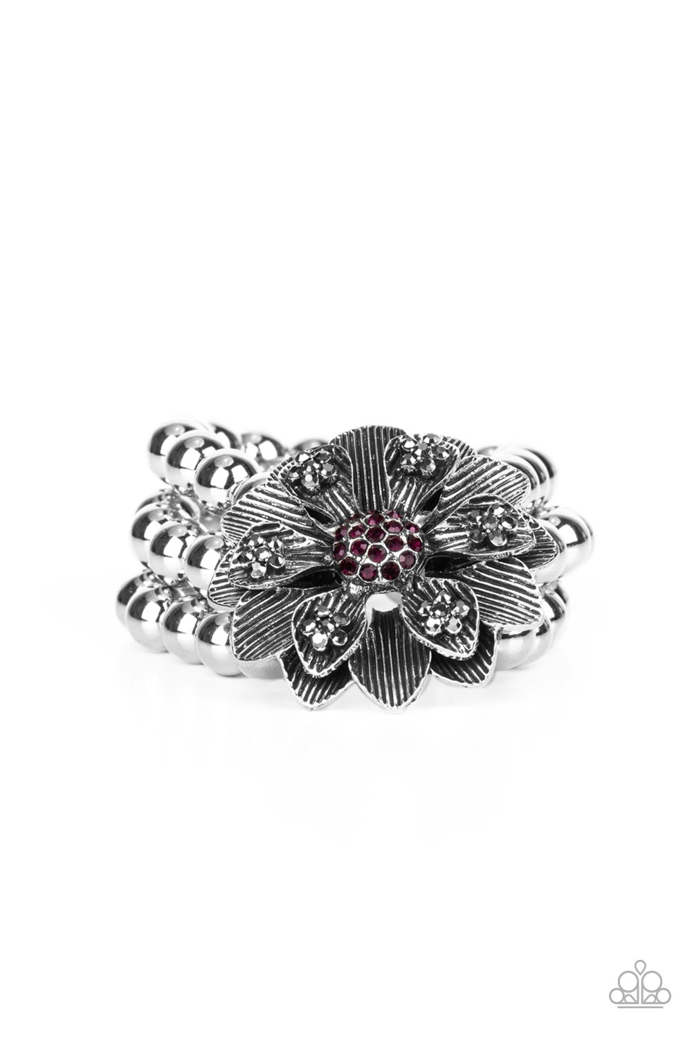 Botanical Bravado Purple Bracelet - Paparazzi Accessories A daring oversized silver flower is composed of petals lined in antiqued silver and dotted with smoky hematite rhinestones. A sphere of dainty purple rhinestones creates the center of the flower as it sits atop a trio of shiny silver beaded stretchy bands around the wrist for a dramatically whimsical look. Sold as one individual bracelet.