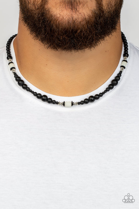 Stone Synchrony - White Item #P2MN-URWT-003XX Grounding sections of dainty silver beads and white stone accents adorn a strand of black stone beads, creating an earthy compliment below the collar. Features an adjustable clasp closure.  Sold as one individual necklace.