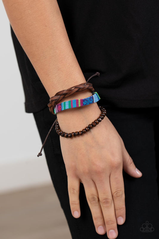 Textile Texting Blue Urban Bracelet - Paparazzi Accessories  An earthy compilation of wooden beads, braided leather, and colorful textile fabric layers around the wrist for an adventurous fashion. Features an adjustable sliding knot closure.  Sold as one individual bracelet.