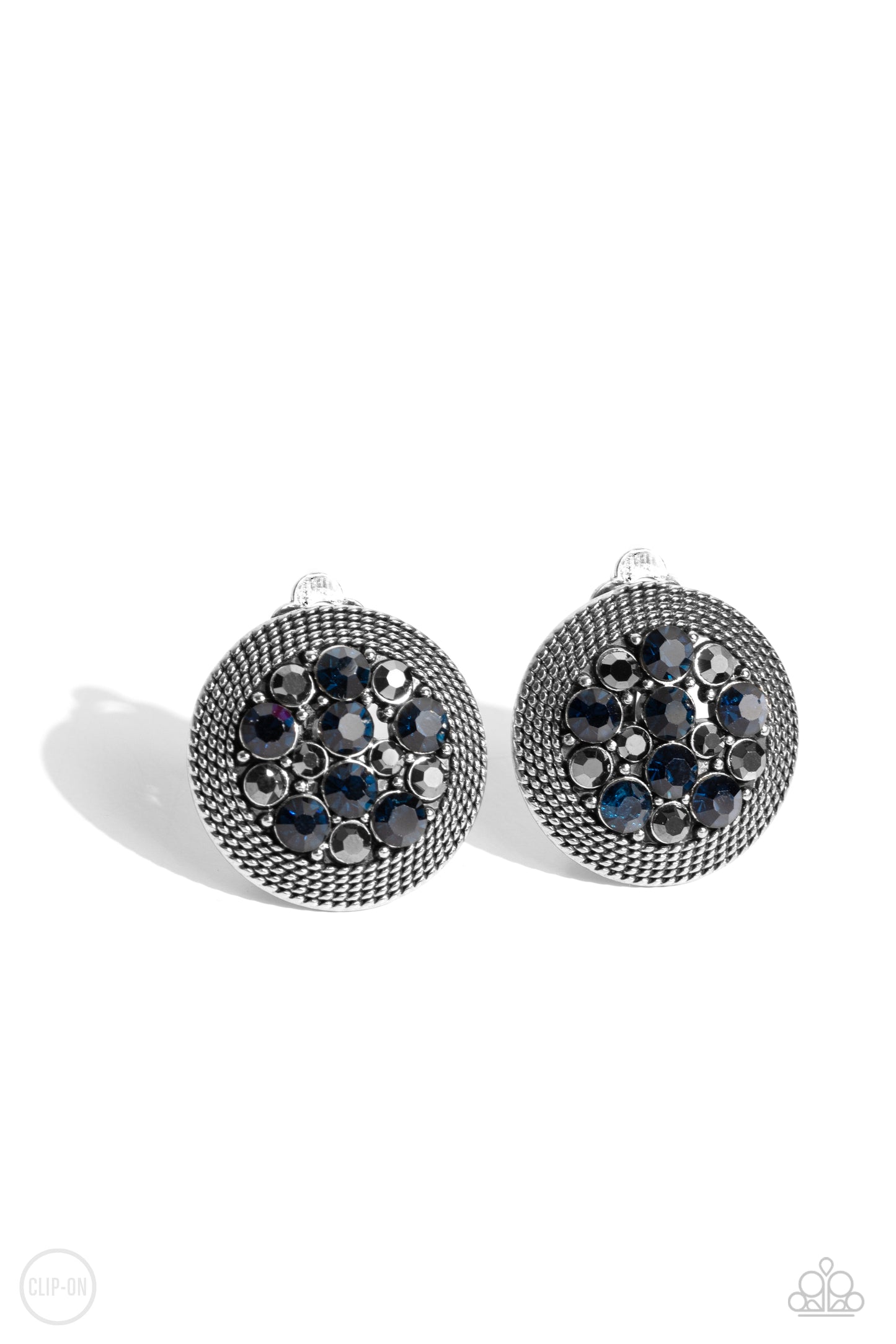 Stellar Status Blue Clip-On Earring - Paparazzi Accessories A glitzy collection of blue and hematite rhinestones are encircled with a silver rope-like border, resulting in a smoldering centerpiece. Earring attaches to a standard clip-on earrings. Sold as one pair of clip-on earrings. New KitClip On Earring Sku: P5CO-BLXX-055XX
