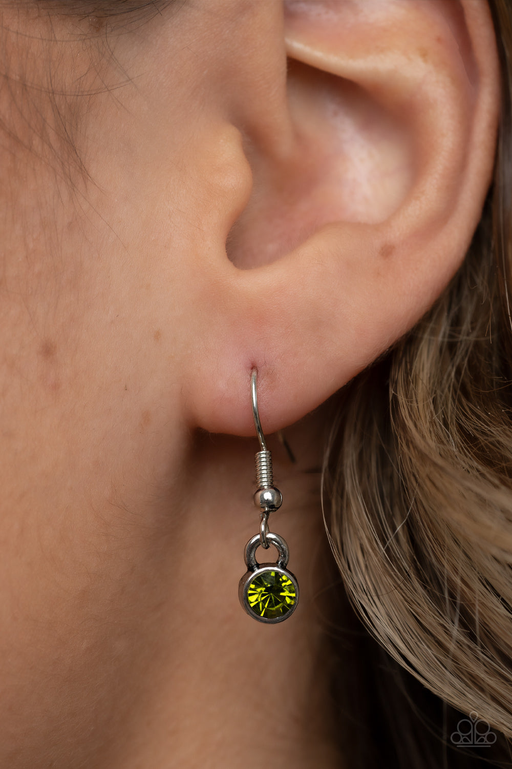 Autumn Abundance Green Necklace - Paparazzi Accessories Dainty green rhinestones are sprinkled across the top of a silver tree beautifully branching inside an oval silver frame, resulting in a seasonal pendant at the bottom of an extended silver chain. Features an adjustable clasp closure. Sold as one individual necklace. Includes one pair of matching earrings.