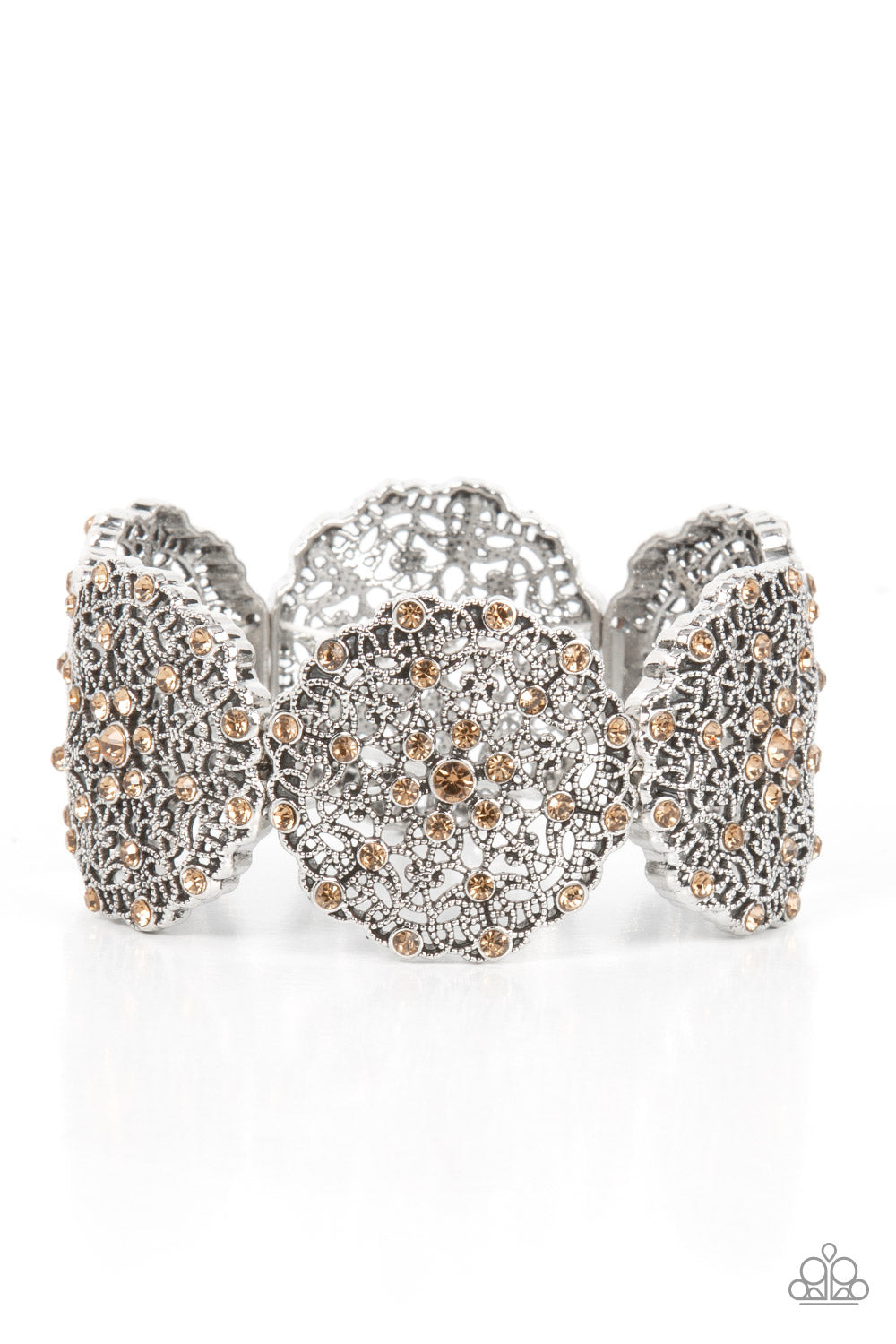 All in the Details Brown Bracelet - Paparazzi Accessories Dotted with golden topaz rhinestones, studded silver frames are filled with mandala-like filigree details and threaded along stretchy bands around the wrist for a glitzy pop of color. Sold as one individual bracelet.