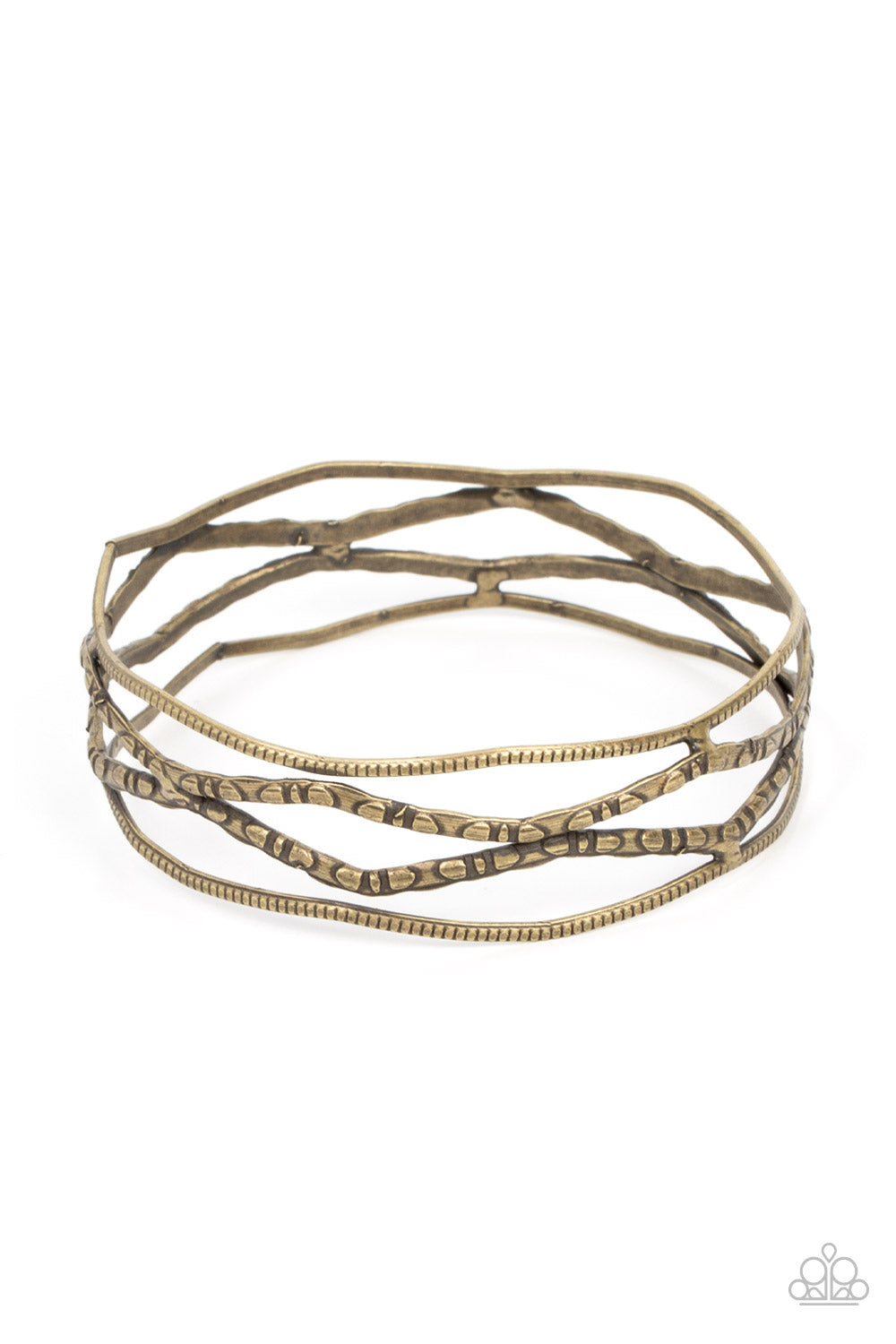 A Narrow ESCAPADE - Brass Item #P9BA-BRXX-059XX Textured and embossed in nature inspired patterns, rustic brass bars zigzag around the wrist as they stack into a wildly layered bangle. Sold as one individual bracelet.