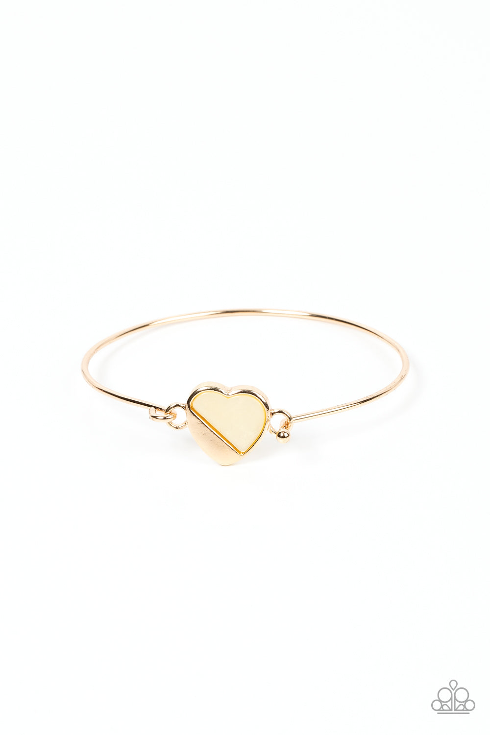 Hidden Intentions Gold Bracelet - Paparazzi Accessories A glistening gold plate slants across a white shell-like heart charm that delicately hinges to a dainty gold bangle-like bracelet, creating a charming centerpiece around the wrist. Features a barbell closure. Sold as one individual bracelet.