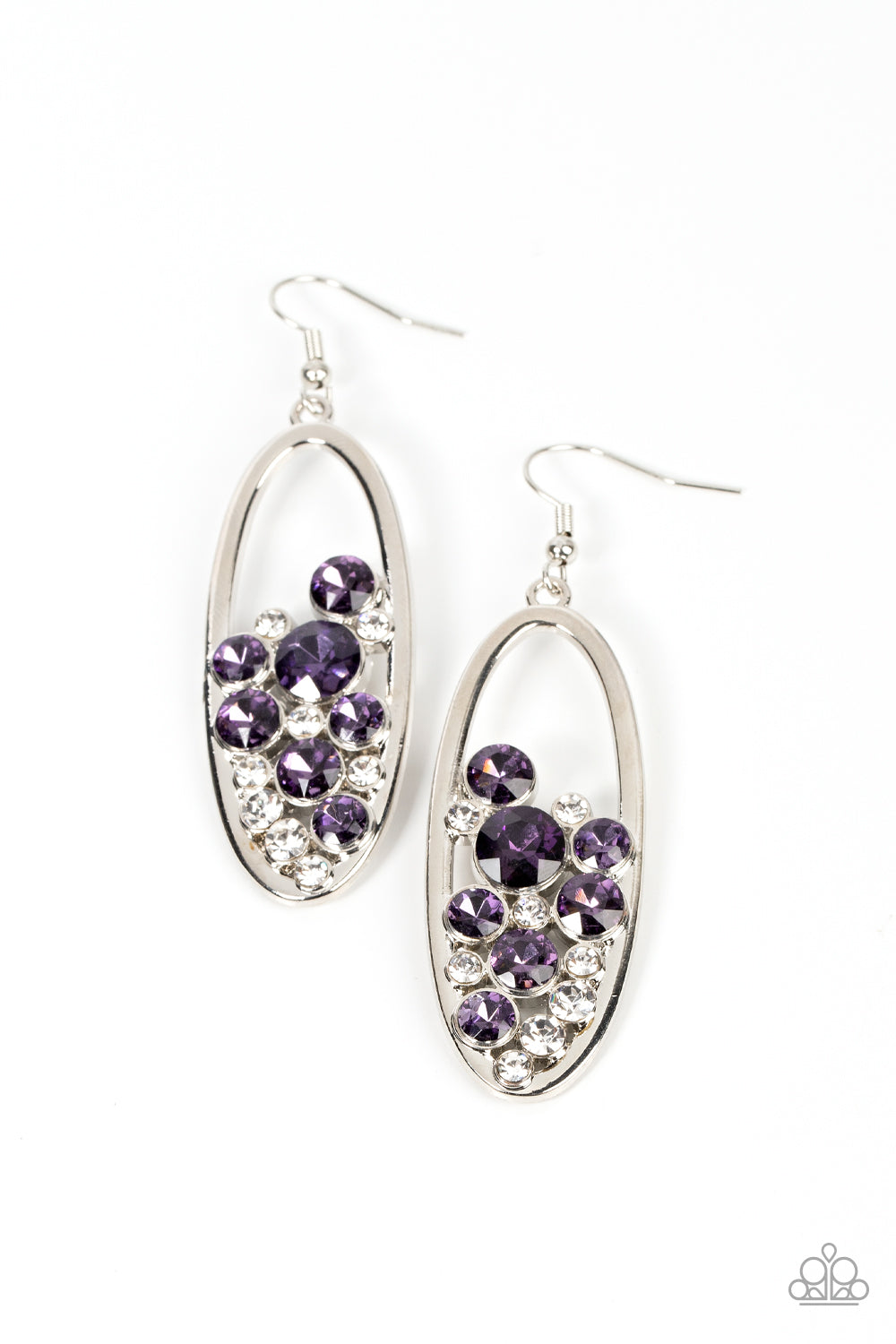 Prismatic Poker Face Purple Earring - Paparazzi Accessories Effervescent stacks of sparkly white and purple rhinestones bubble up inside a simple silver oval frame creating a prismatically stunning lure. Earring attaches to a standard fishhook fitting. Sold as one pair of earrings.