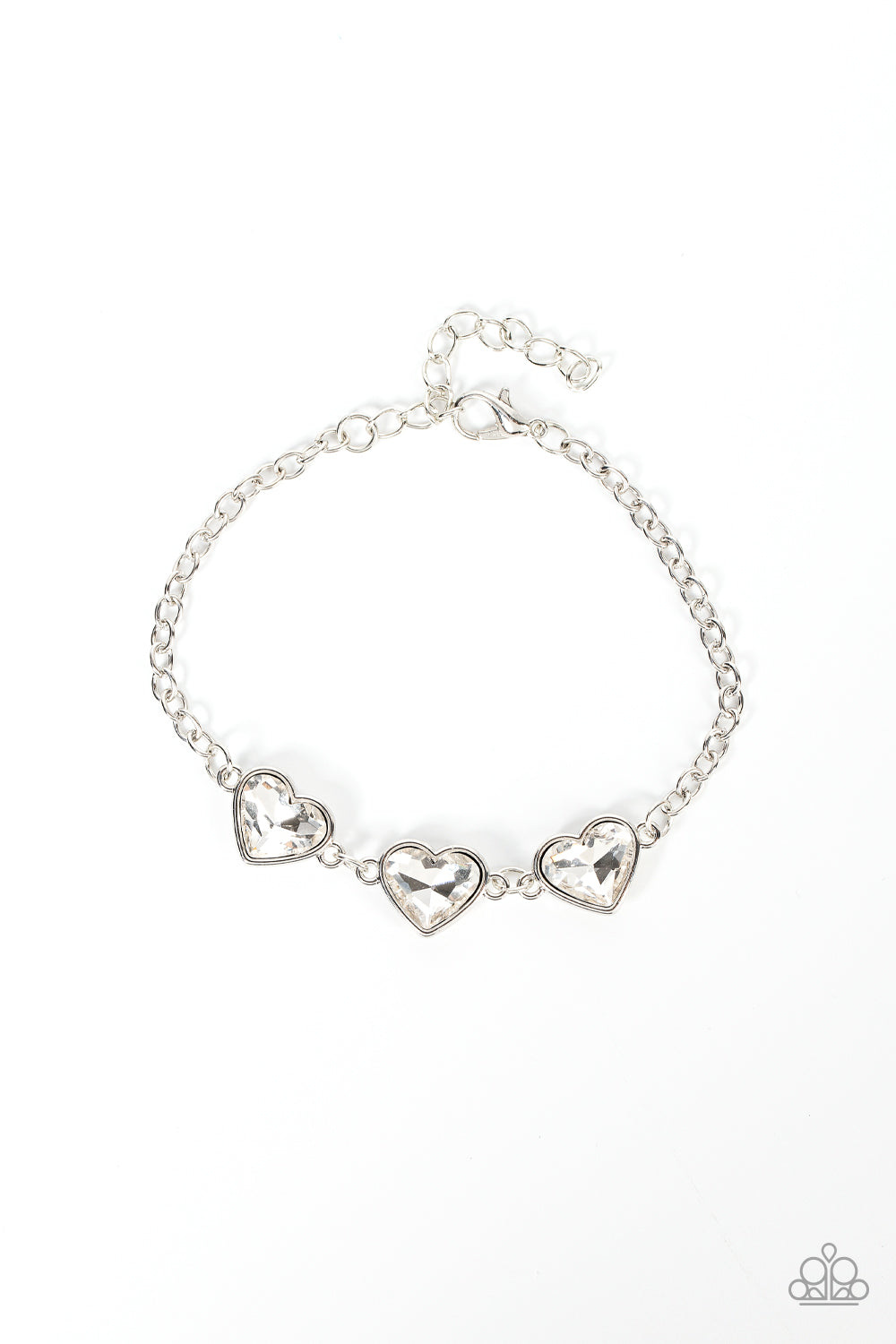 Little Heartbreaker White Bracelet - Paparazzi Accessories Nestled in silver frames, a trio of glittery white heart-shaped gems delicately links across the wrist for a dash of swoon-worthy shimmer. Features an adjustable clasp closure. Sold as one individual bracelet.