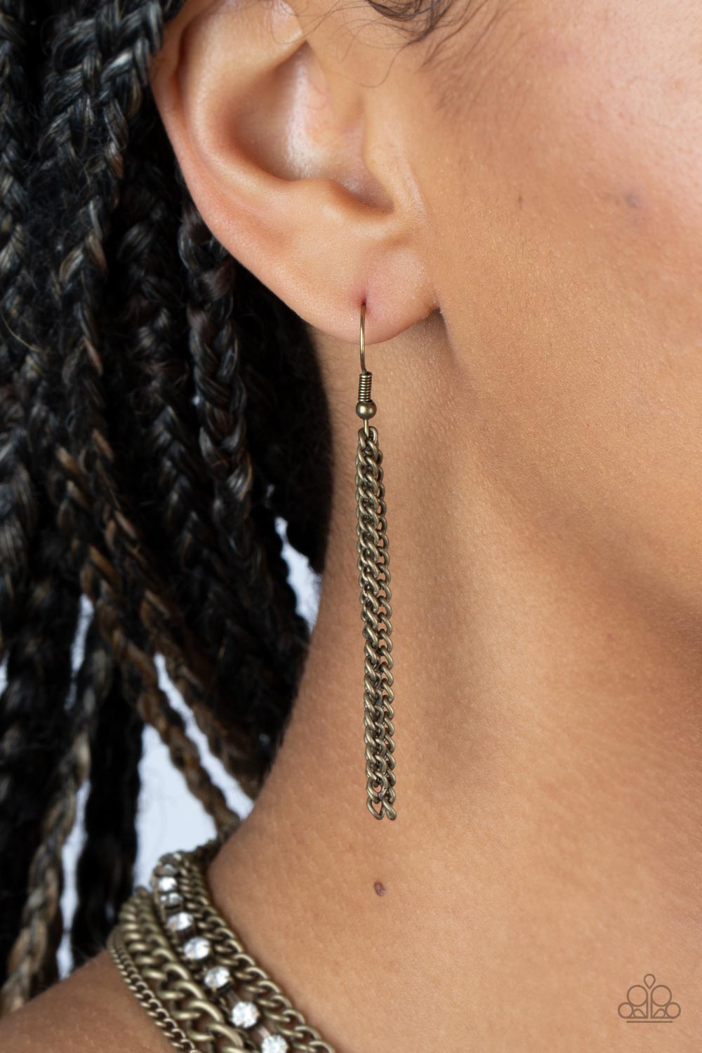 Free to CHAINge My Mind Brass Necklace - Paparazzi Accessories A mashup of brass chains collides with a strand of sparkling white rhinestones encased in brass fittings. The contrast of gritty brass finishes and shimmery accents creates a brilliant display of grunge and glitz as the strands layer across the chest in an epic finish. Features an adjustable clasp closure. Sold as one individual necklace. Includes one pair of matching earrings P2IN-BRXX-145XX