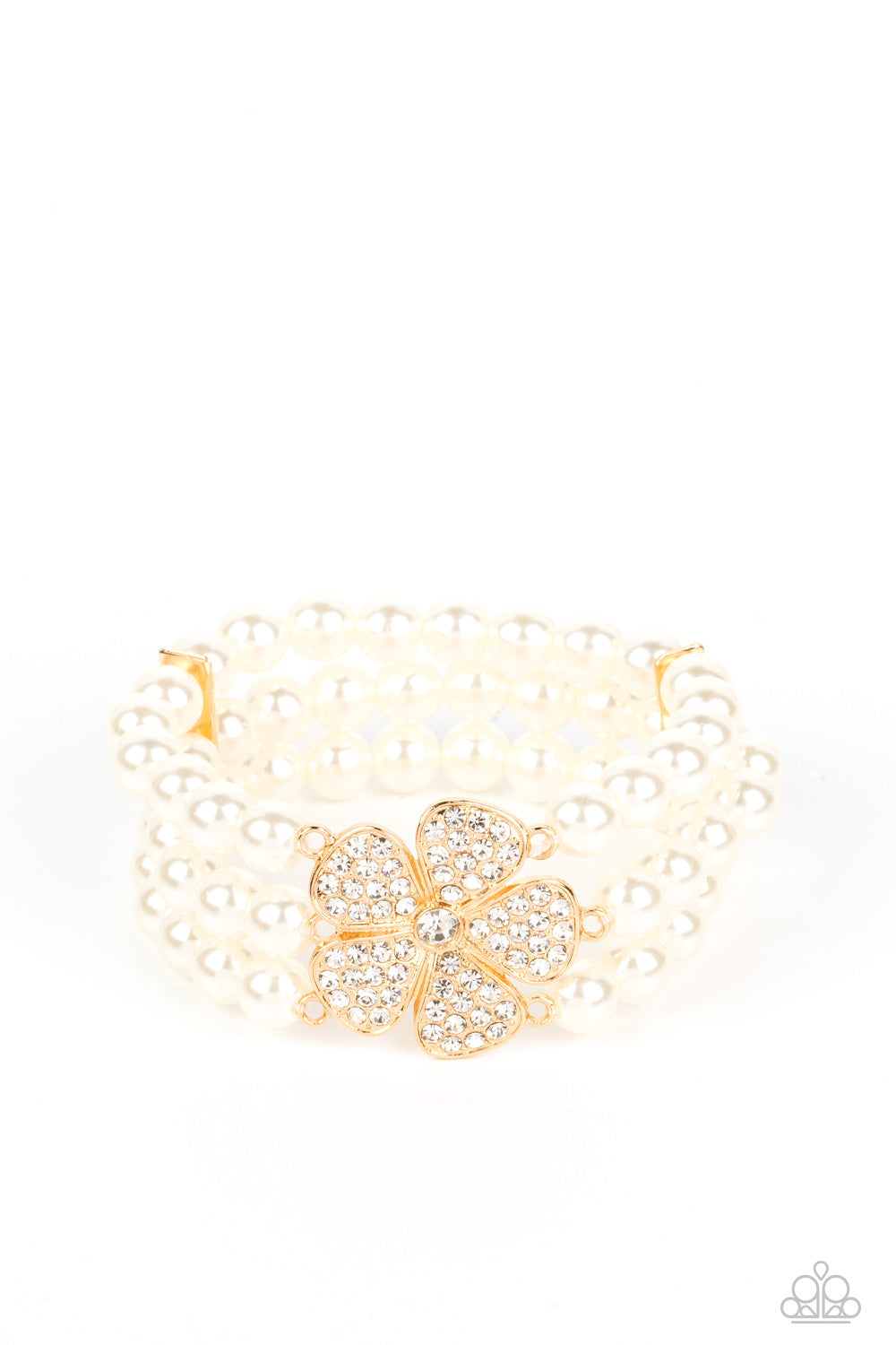 Park Avenue Orchard Gold Pearl Bracelet - Paparazzi Accessories Separated by dainty gold plates, classic white pearls are threaded along three stretchy bands around the wrist. Encrusted in glassy white rhinestones, a glitzy gold flower blooms at the center of the wrist for a fierce floral statement. Sold as one individual bracelet.