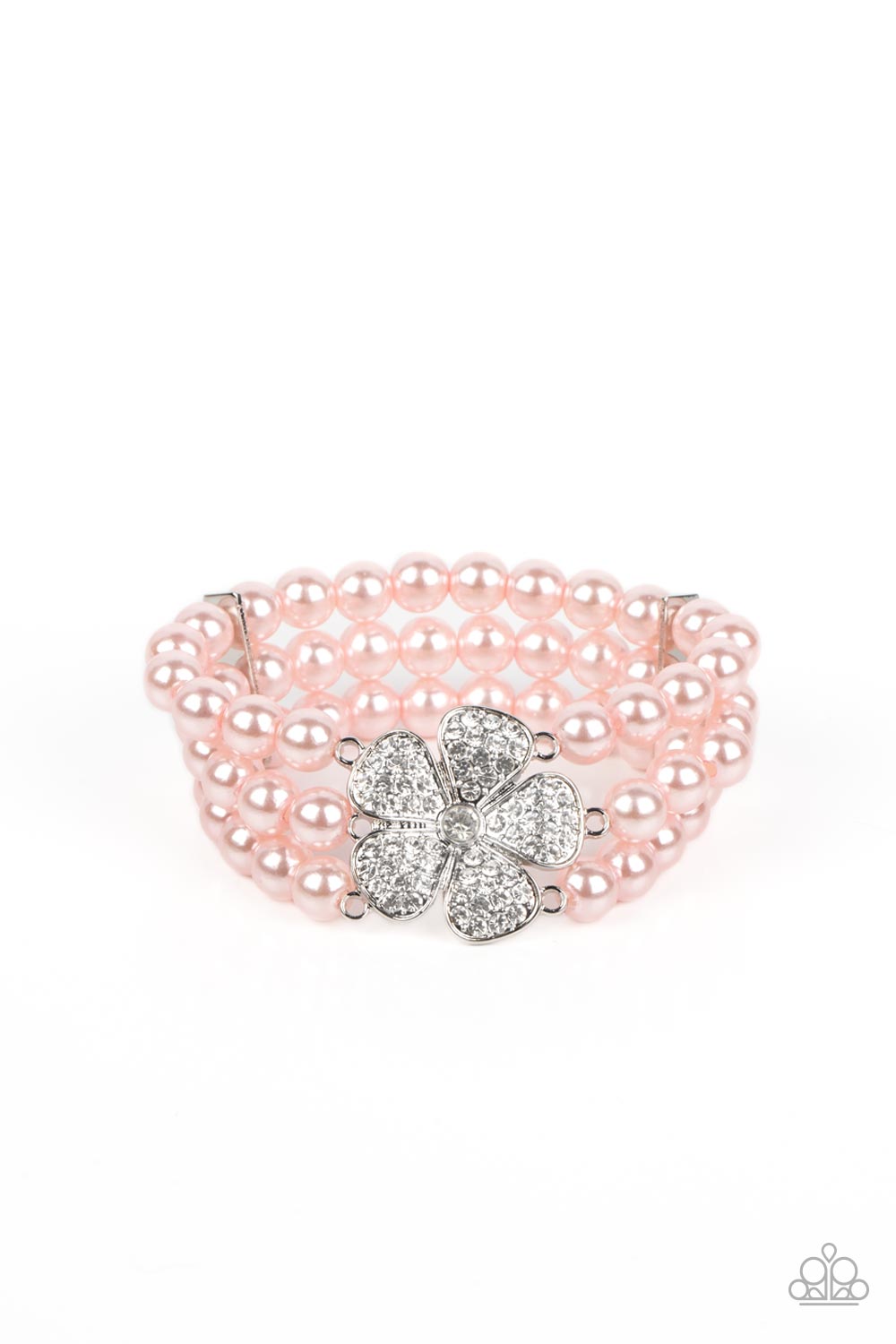 Park Avenue Orchard Pink Bracelet - Paparazzi Accessories Separated by dainty silver plates, bubbly pink pearls are threaded along three stretchy bands around the wrist. Encrusted in glassy white rhinestones, a glitzy silver flower blooms at the center of the wrist for a fierce floral statement. Sold as one individual bracelet.