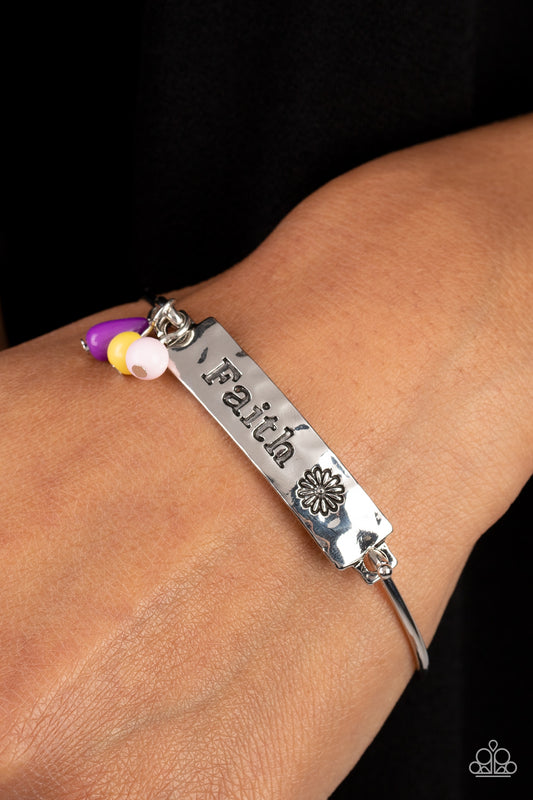 Flirting with Faith Purple Bracelet - Paparazzi Accessories  The word "Faith" and a whimsical daisy silhouette are stamped across a thick hammered plate of silver. Three acrylic beads in the shades of Primrose, purple, and baby pink add a dash of color to this inspirational piece, gathering together where the plate attaches to a skinny silver cuff. Features a hook and eye closure.  Sold as one individual bracelet.