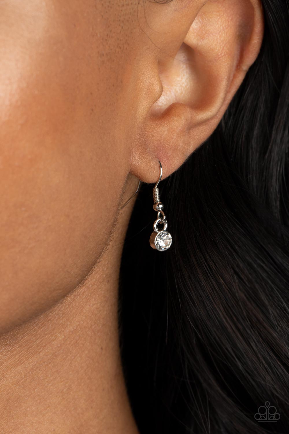 Bedazzled Bliss Red Necklace - Paparazzi Accessories A luxurious airy silver heart lush with glassy white rhinestones swings from a classic silver chain. A faceted heart gem brushed in a red shimmer graces one side of the larger bedazzled heart for a romantic finish. Features an adjustable clasp closure. Sold as one individual necklace. Includes one pair of matching earrings.