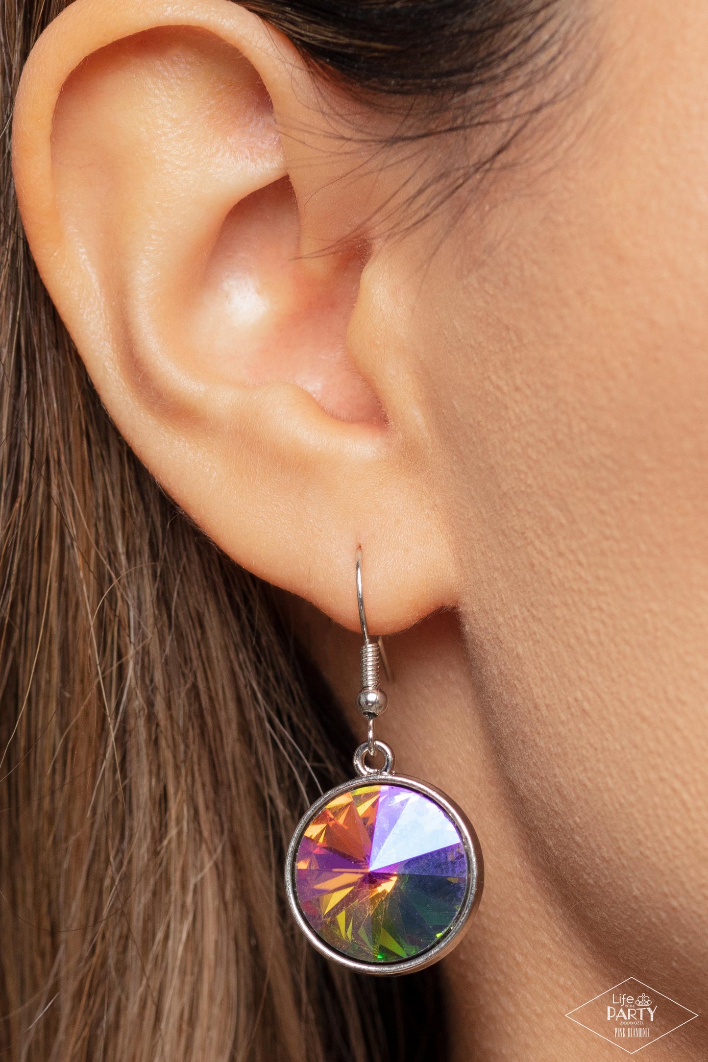 She Sparkles On Multi Necklace - Paparazzi Accessories A dramatic gem with a UV shimmer swings from the bottom of a shiny silver chain, creating a blinding pendant below the collar. Features a toggle closure. Due to its prismatic palette, color may vary. Sold as one individual necklace. Includes one pair of matching earrings. P2RE-MTXX-219XX New KitENCORE This Pink Diamond Encore is back in the spotlight at the request of our 2022 Life of the Party member with Pink Diamond Access, Heather C.