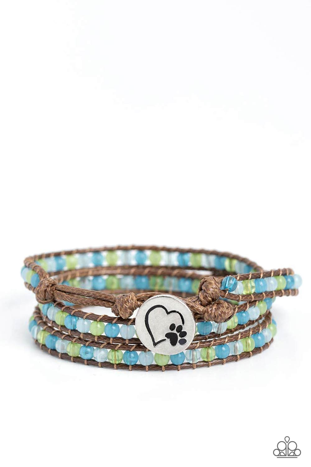 PAW-sitive Thinking Blue Wrap Bracelet - Paparazzi Accessories Infused with an antiqued heart and pawprint embossed button, a row of blue and green multicolored cloudy and milky beads are knotted in place along two brown leather cords, creating multiple earthy layers around the wrist with its extended length. Features an adjustable button loop closure. Sold as one individual bracelet. P9UR-BLXX-254XX