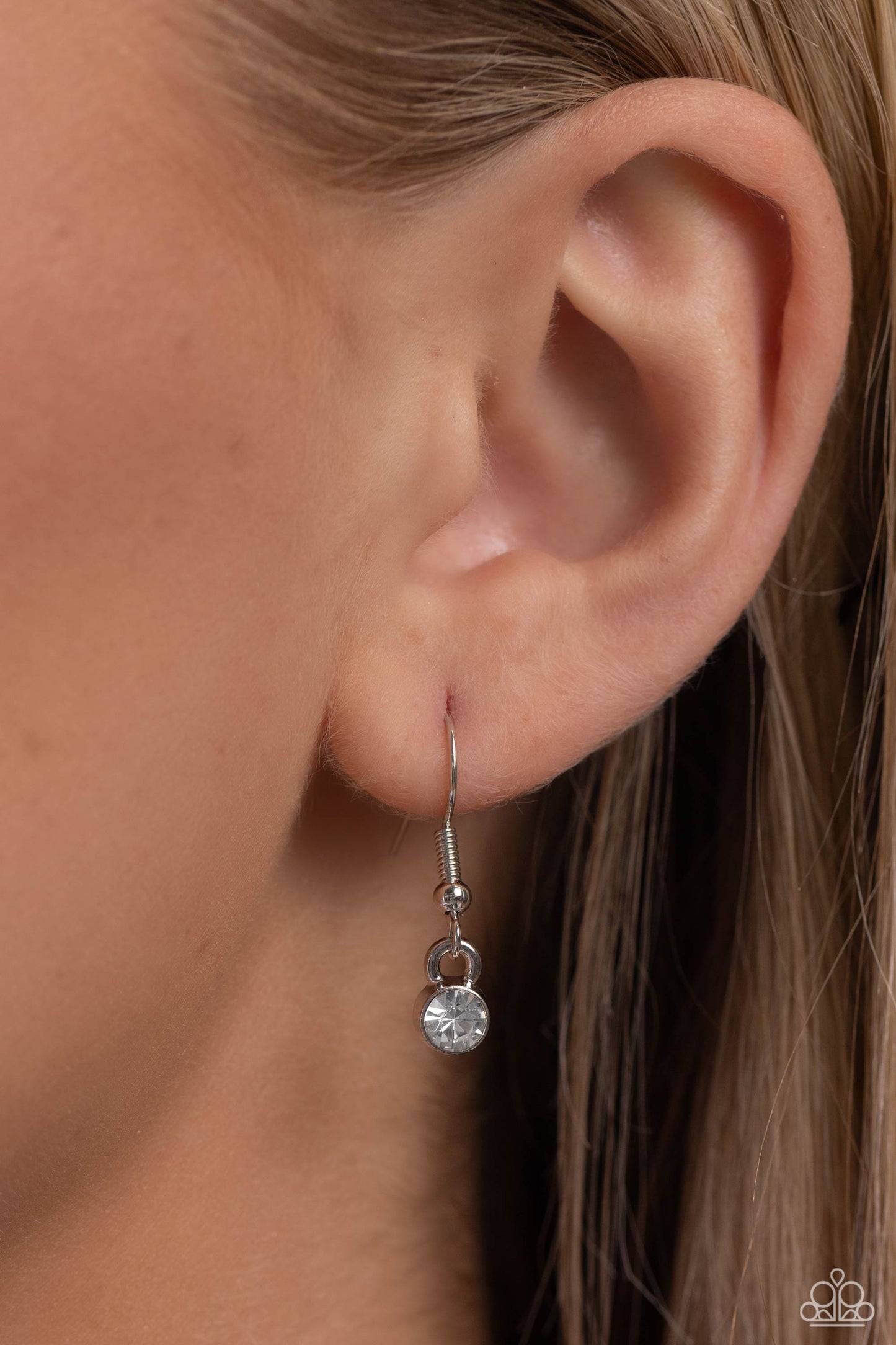 PET in Motion White Paw Print Necklace - Paparazzi Accessories Featuring a paw print charm, an airy rhinestone-embossed heart frame glides down the neckline on a dainty, classic silver chain for a pet-lover inspired pendant. Features an adjustable clasp closure. Sold as one individual necklace. Includes one pair of matching earrings. P2DA-WTXX-271XX