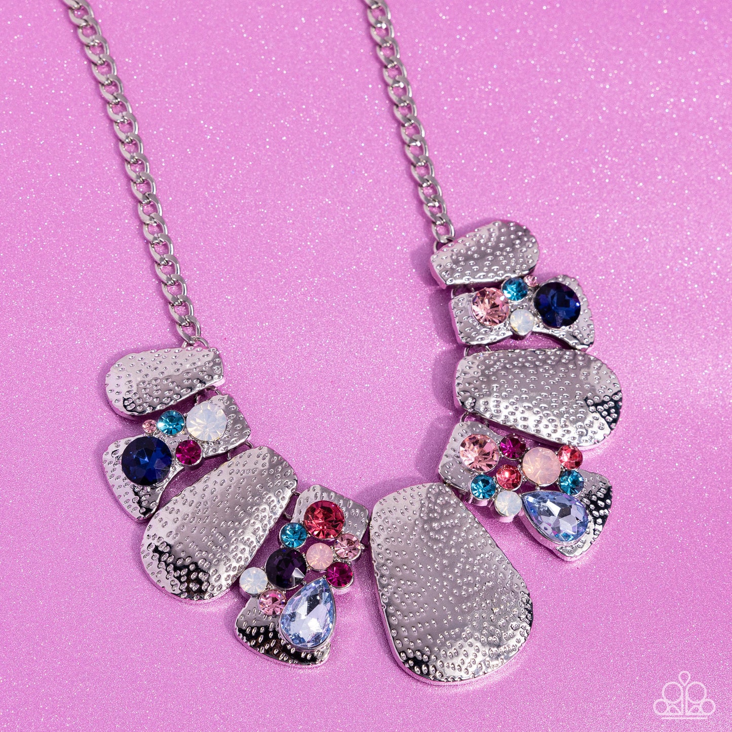Multicolored Mayhem Multi Necklace - Paparazzi Accessories A collection of hammered silver plates in various sizes delicately link below the collar, creating a boldly imperfect geometric fringe. Round and teardrop gems in various shades and sizes adorn every other frame in a haphazard pattern for an explosion of sparkle. Features an adjustable clasp closure. Sold as one individual necklace. Includes one pair of matching earrings. SKU: P2ST-MTXX-133XX *LOP January 2024
