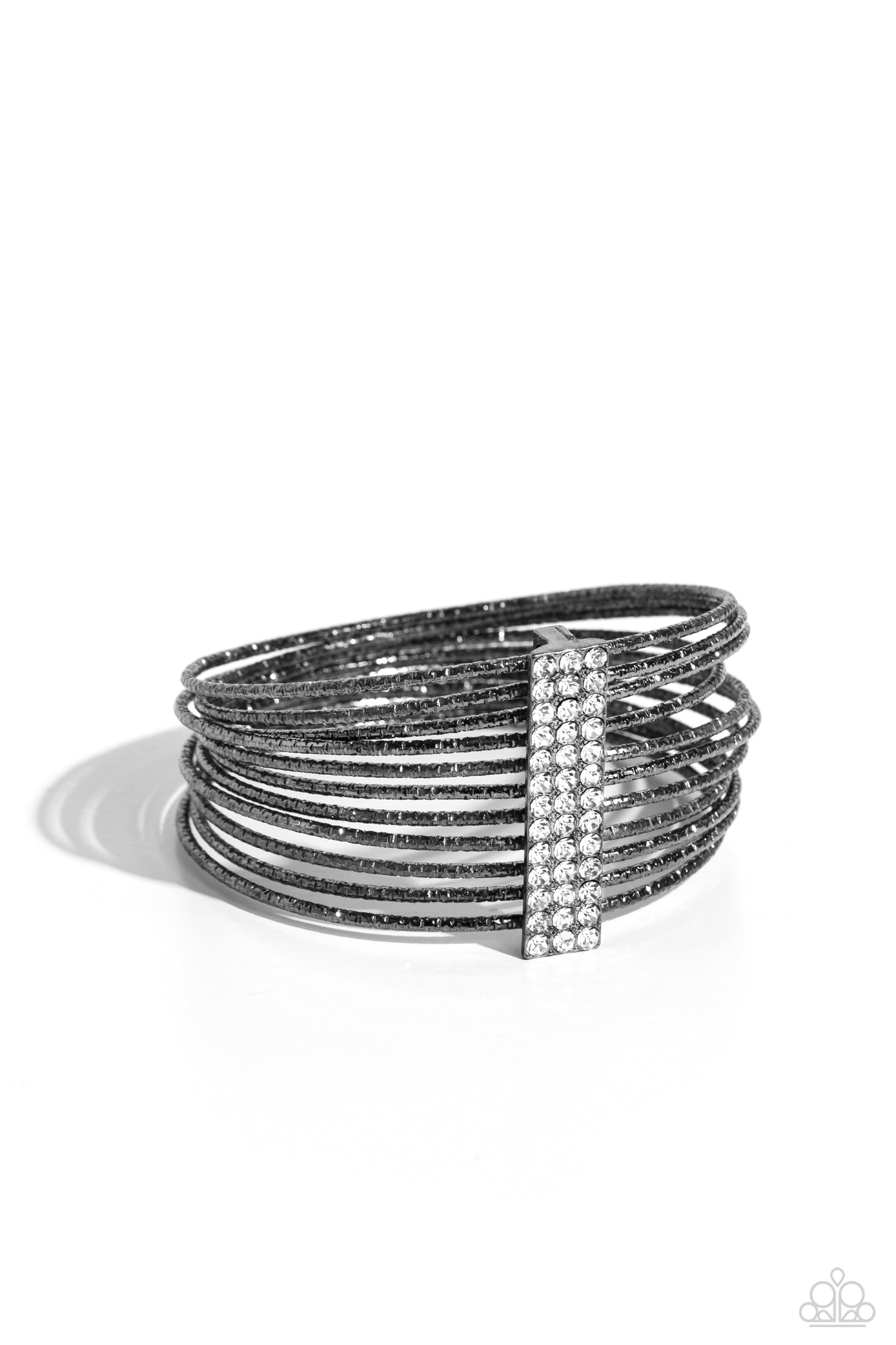 Shimmery Silhouette Black Bangle Bracelet - Paparazzi Accessories Held together by an elongated rectangular gunmetal fitting and encrusted in three rows of white gems, gunmetal bangles embossed in shimmery diamond-cut textures stack across the wrist for a refined display. Sold as one individual bracelet. Sku: P9RE-BKXX-382XX