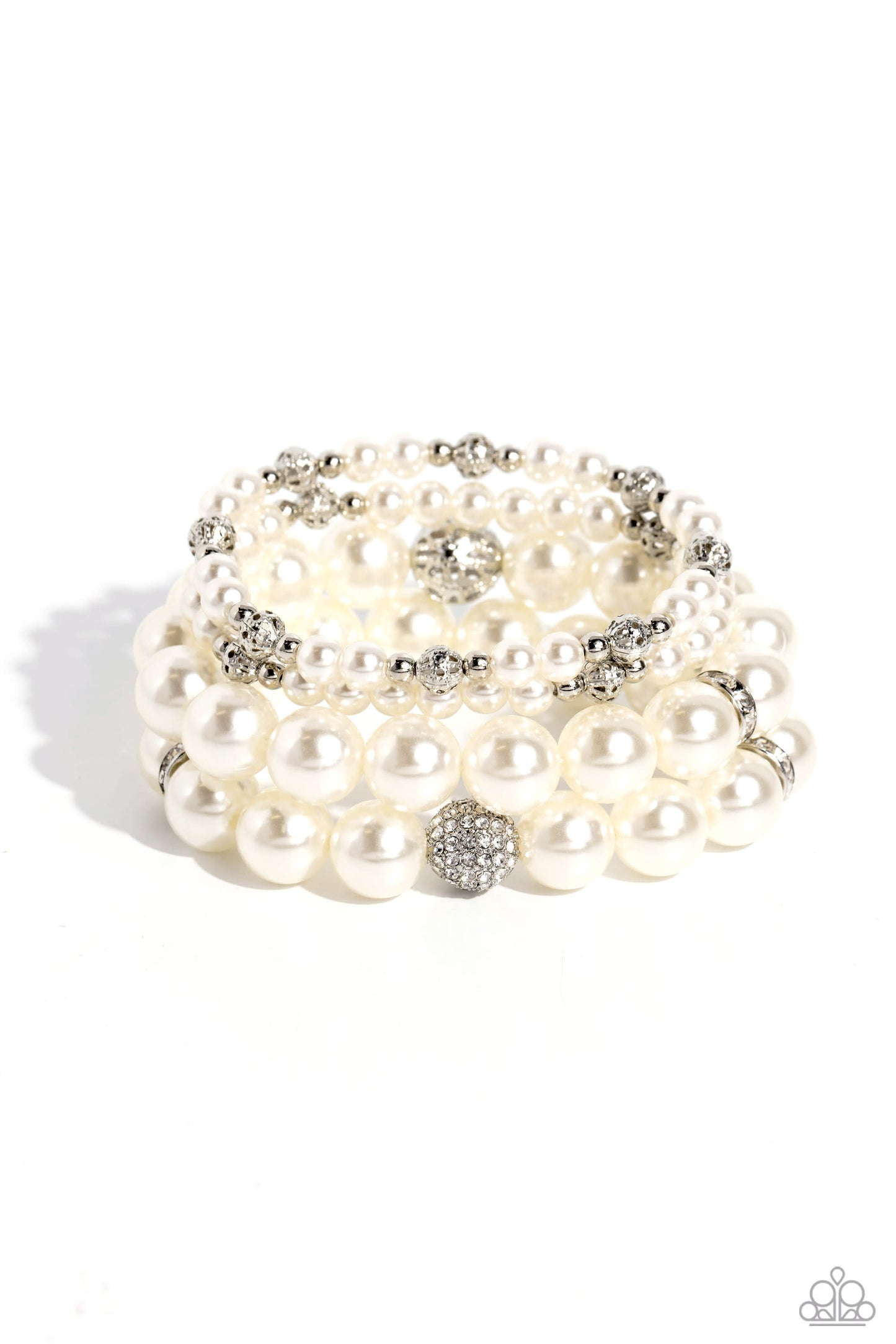 Vastly Vintage White Pearl Bracelet - Paparazzi Accessories Infused with white rhinestone-encrusted silver beads, white rhinestone-encrusted discs, and textured silver beads, a bubbly collection of mismatched white pearls are threaded along stretchy bands around the wrist for a vintage-inspired layered look. Sold as one set of four bracelets. P9RE-WTXX-565XX
